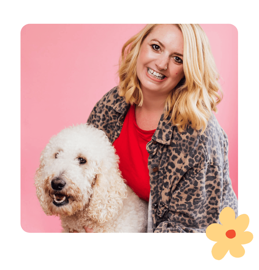 Kate - studio owner of Kurly Creative smiling with her pet poodle Sienna