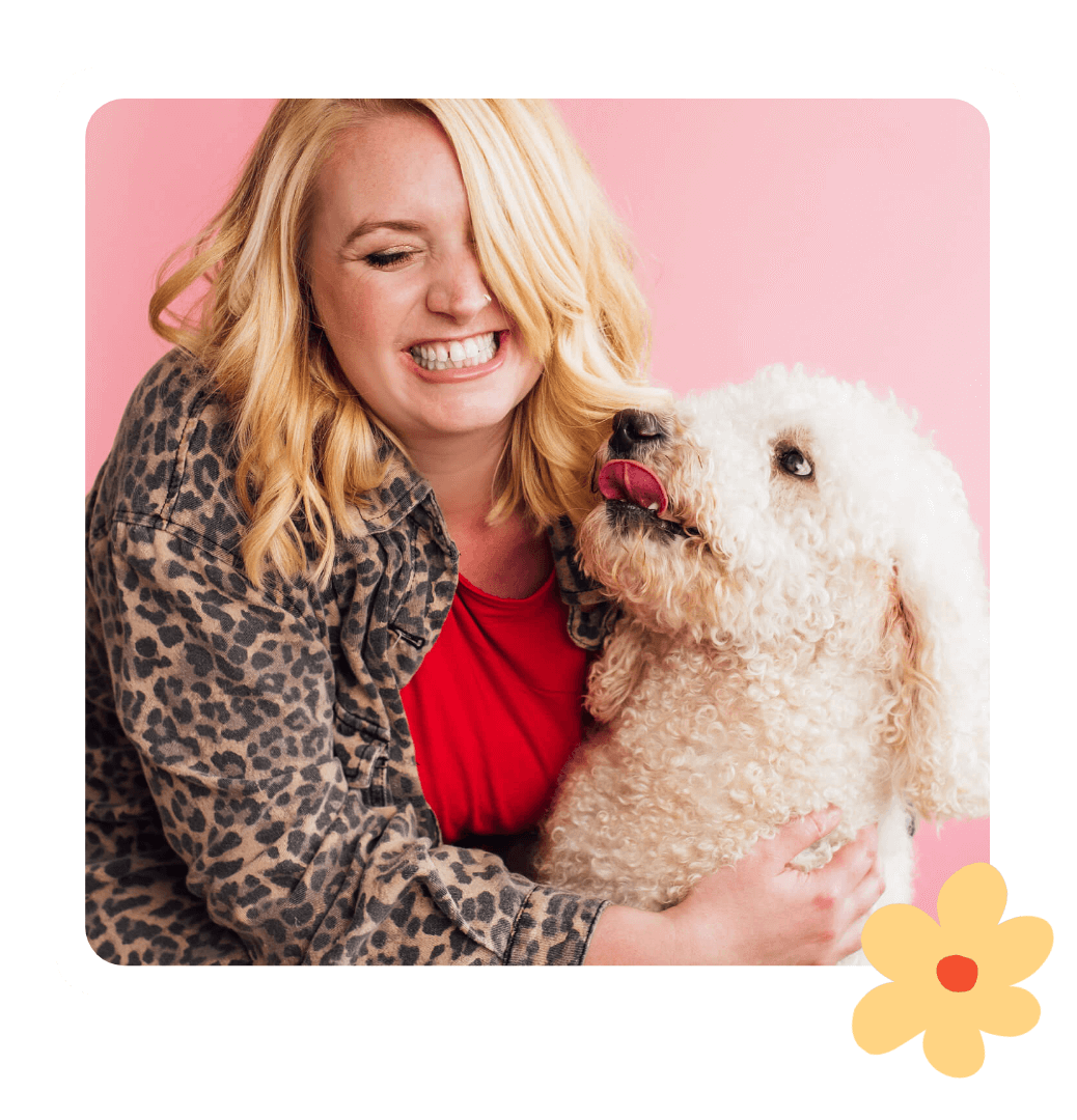 Kate - studio owner of Kurly Creative getting licked by her pet poodle Sienna