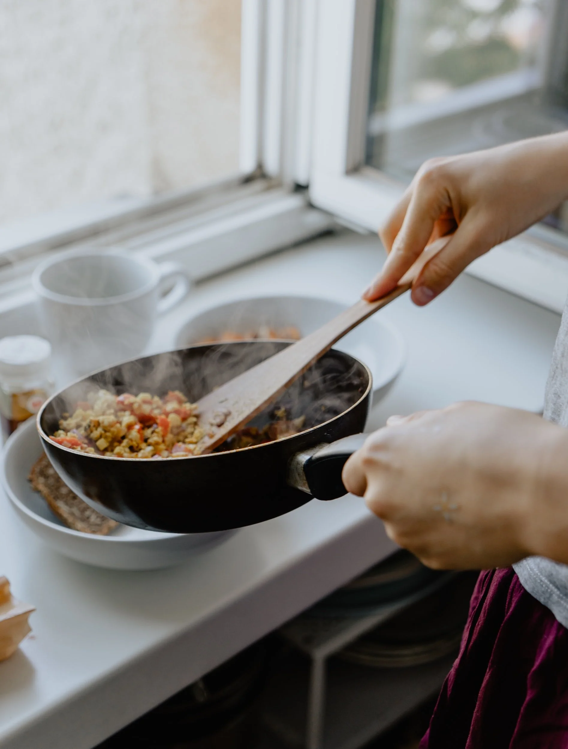Steam rising from hot food in pan