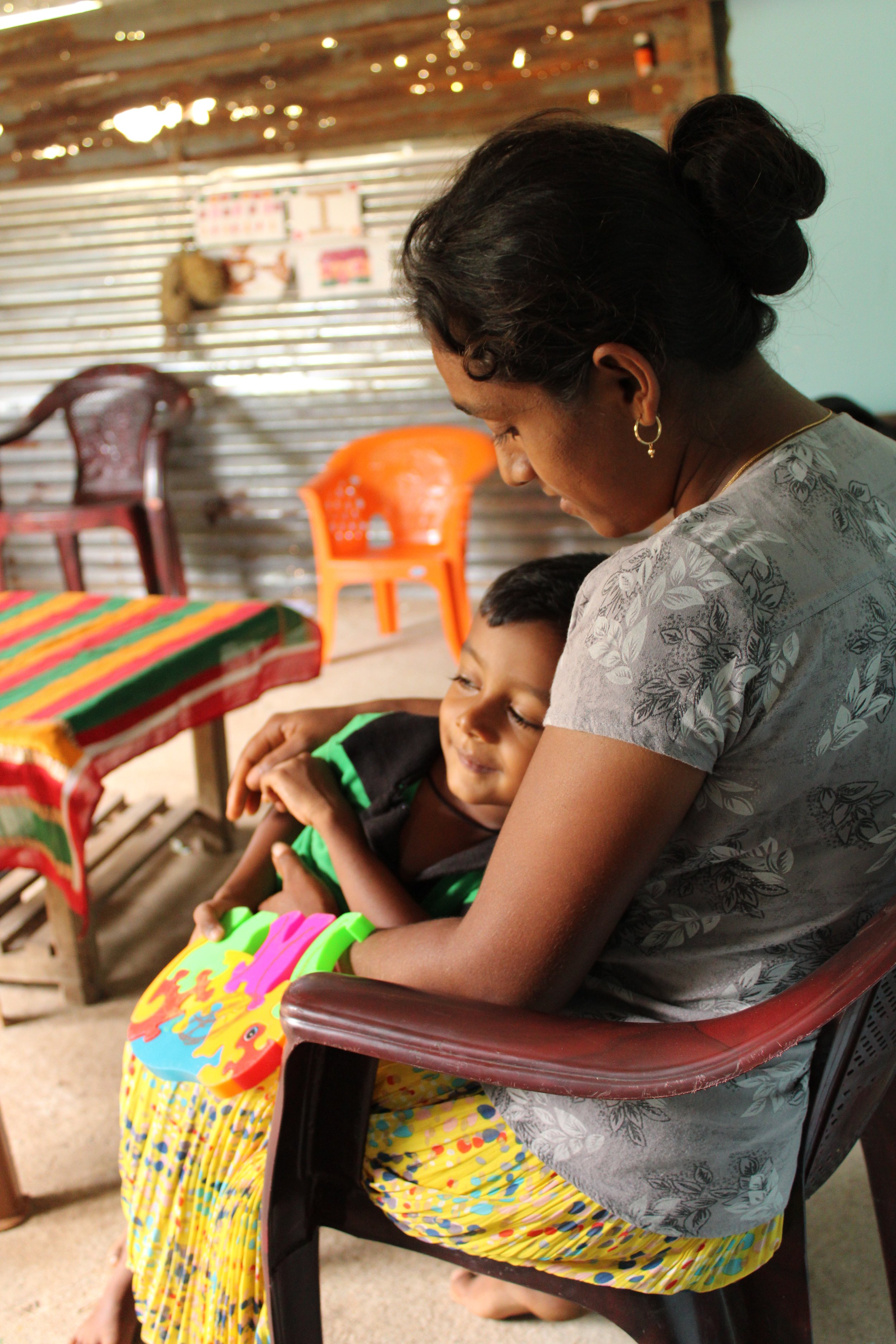  Above: Chamod gets a hug from his mother, Nimali. Photo: Madara Gunawardana/World Vision Lanka 