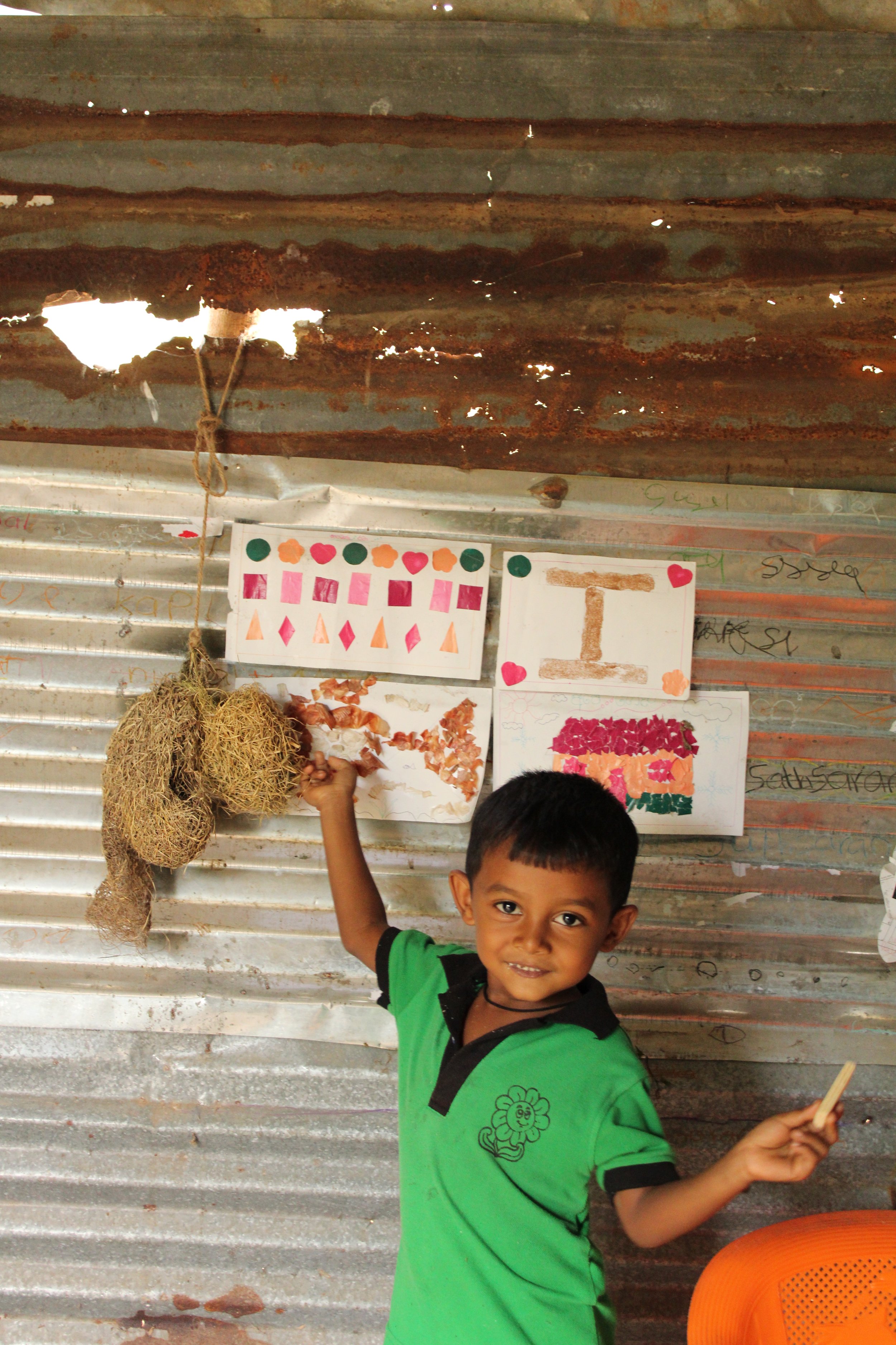  Chamod showing his drawings and crafts. Photo: Madara Gunawardana/World Vision Lanka 