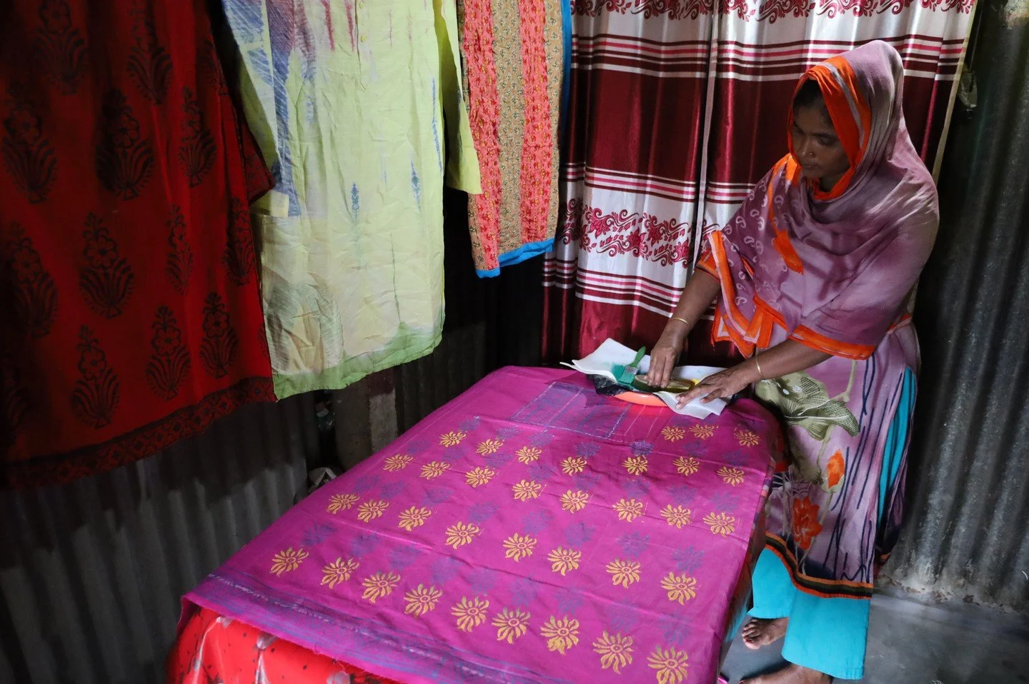 Driven by a desire to reshape her future, Kulsuma completed a six-day training on nakshi katha (Bengali embroidery), block batik (fabric printing), and sewing, organised by Mukti Cox's Bazar through the AHP response in Bangladesh, which supports both