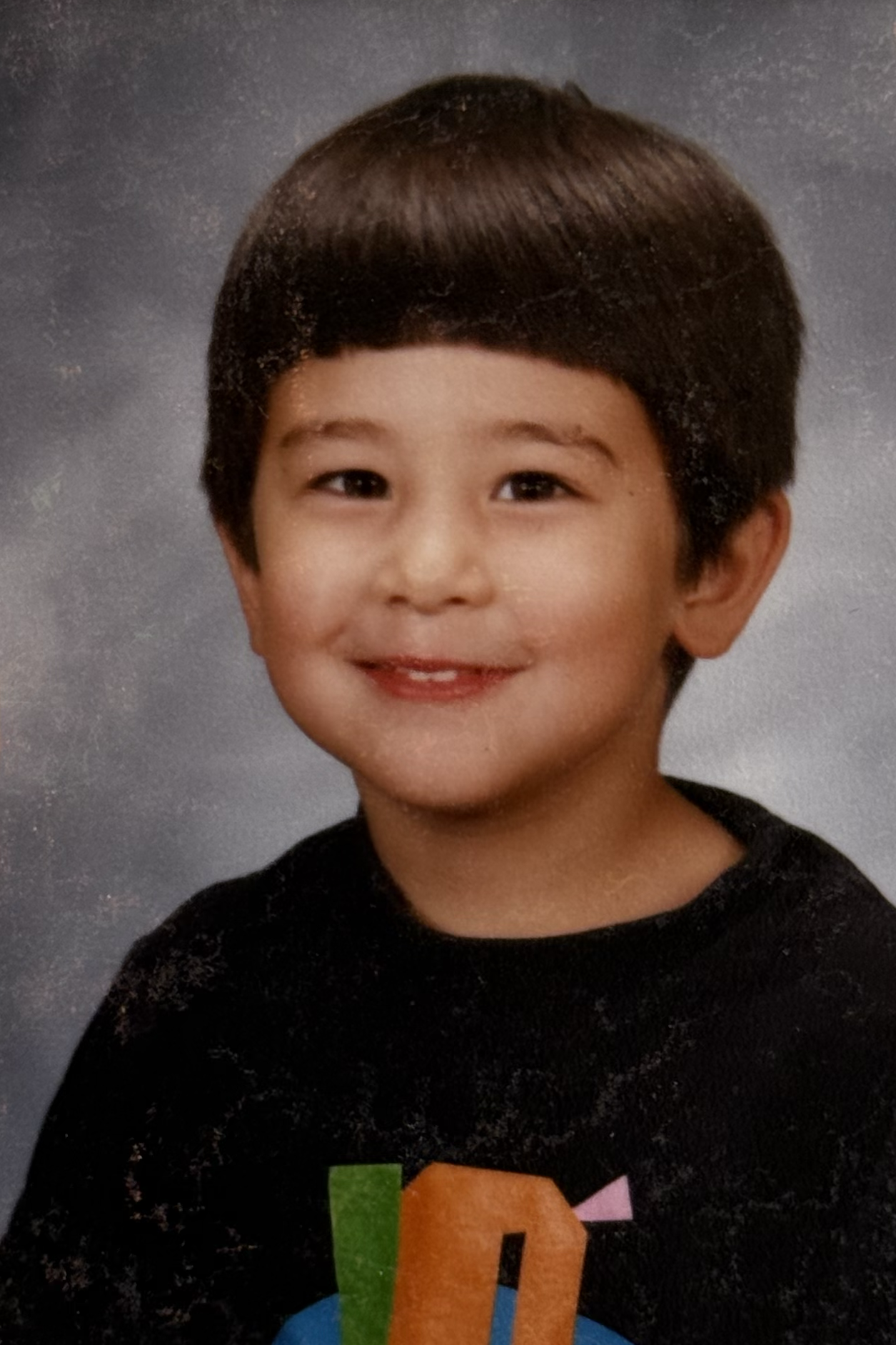 Zach's kindergarten picture from 1994 — the bowl cut and black tee must have been a sign of the future.