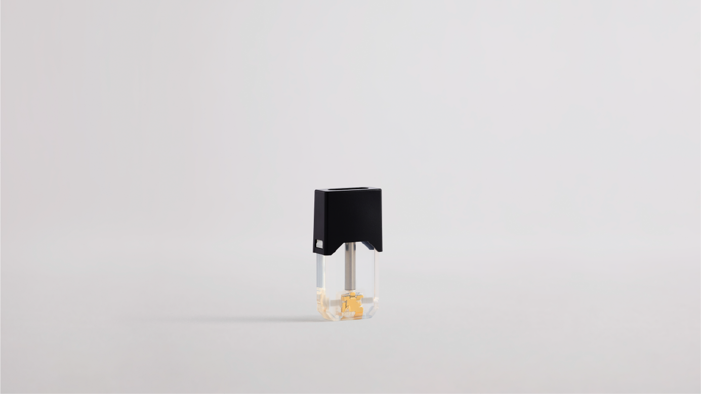 A "J1" JUULpod with no plastic cap, showing the technology that vaporizes e-liquid.