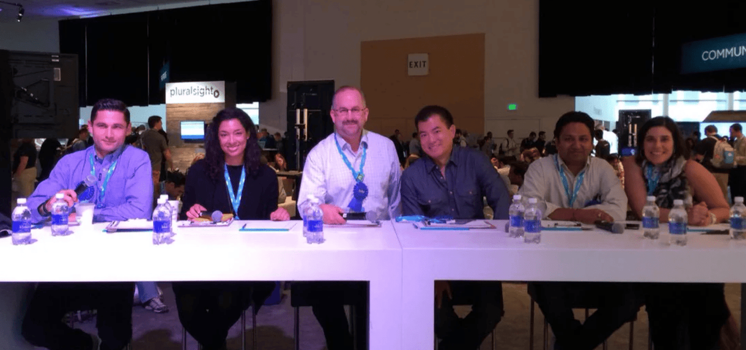 The Dreamforce 2014 hackathon final jury panel seated at a long white table