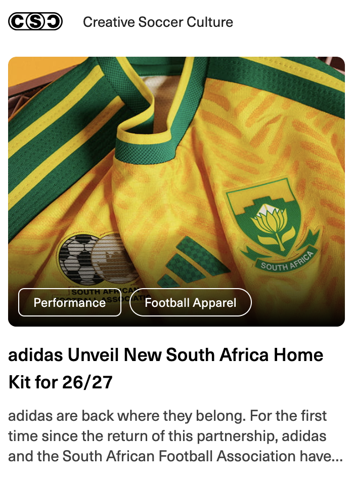 Close-up of South African football kit with green and yellow colors, featuring the South Africa Football Association logo and FIFA patches.