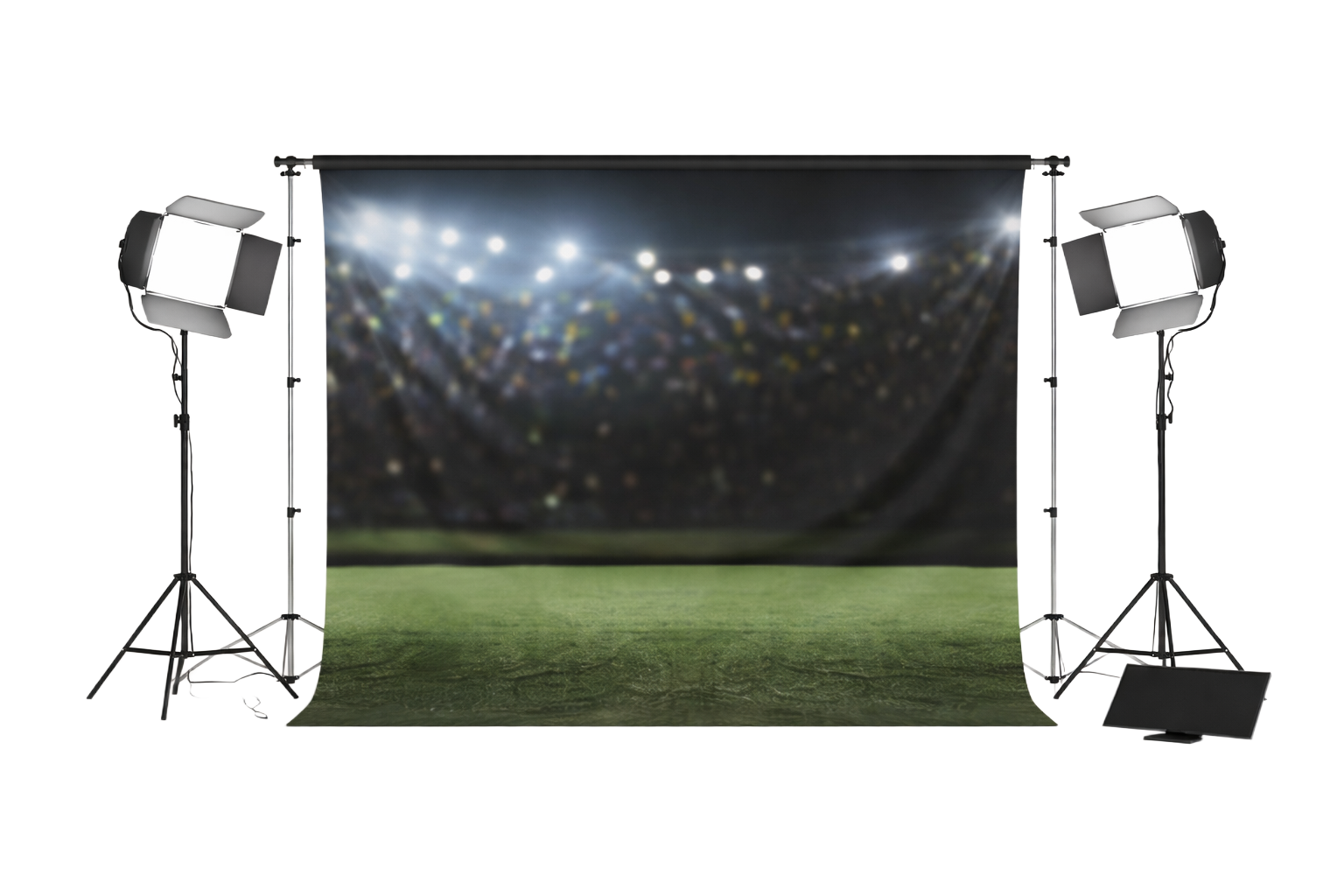 adidas Football safa world cup jersey launch campaign. Photo of a backdrop with stadium lights and crowd, flanked by professional lighting equipment on stands, set up on a green field for photography or filming.