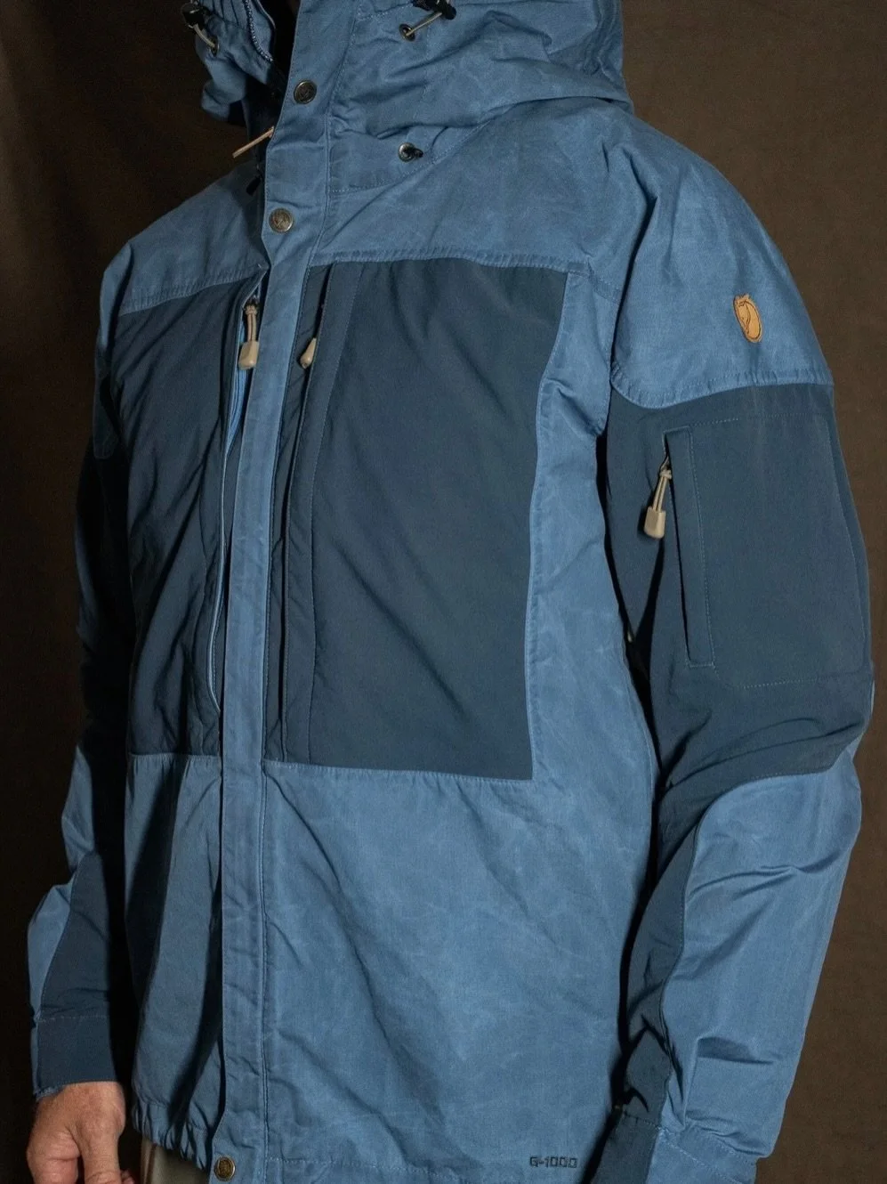 Our custom Fjallraven Keb jacket departs the store to a new customer...

Reworked with a new &lsquo;solstice blue&rsquo; colourway / new mil grade shock cord on hood and hem / brand new branded leather main zip puller riveted / original leather logo 