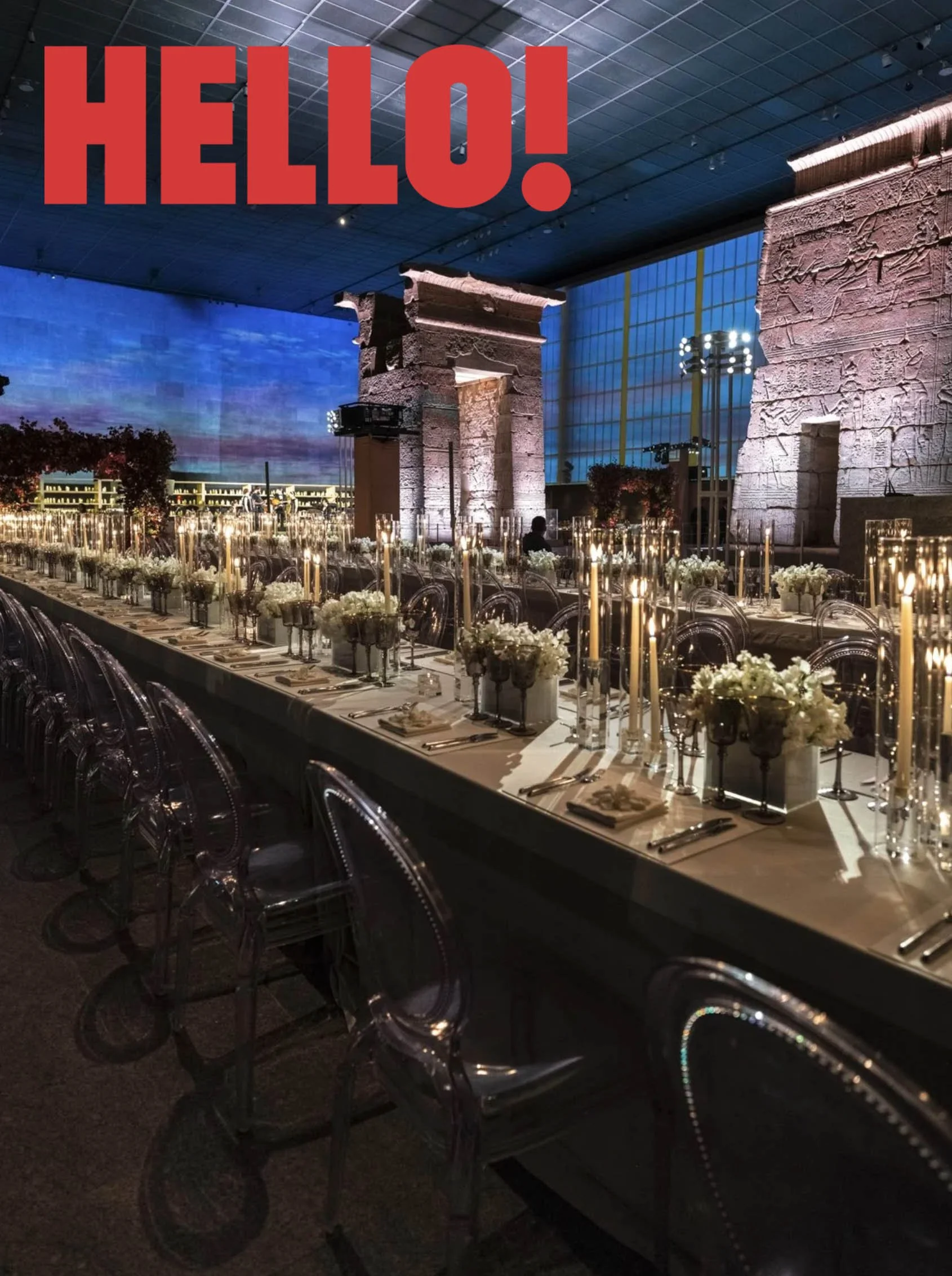 Elegant banquet table set with flowers, candles, and tableware inside a large digital 'HELLO!' message prominently displayed at the top.