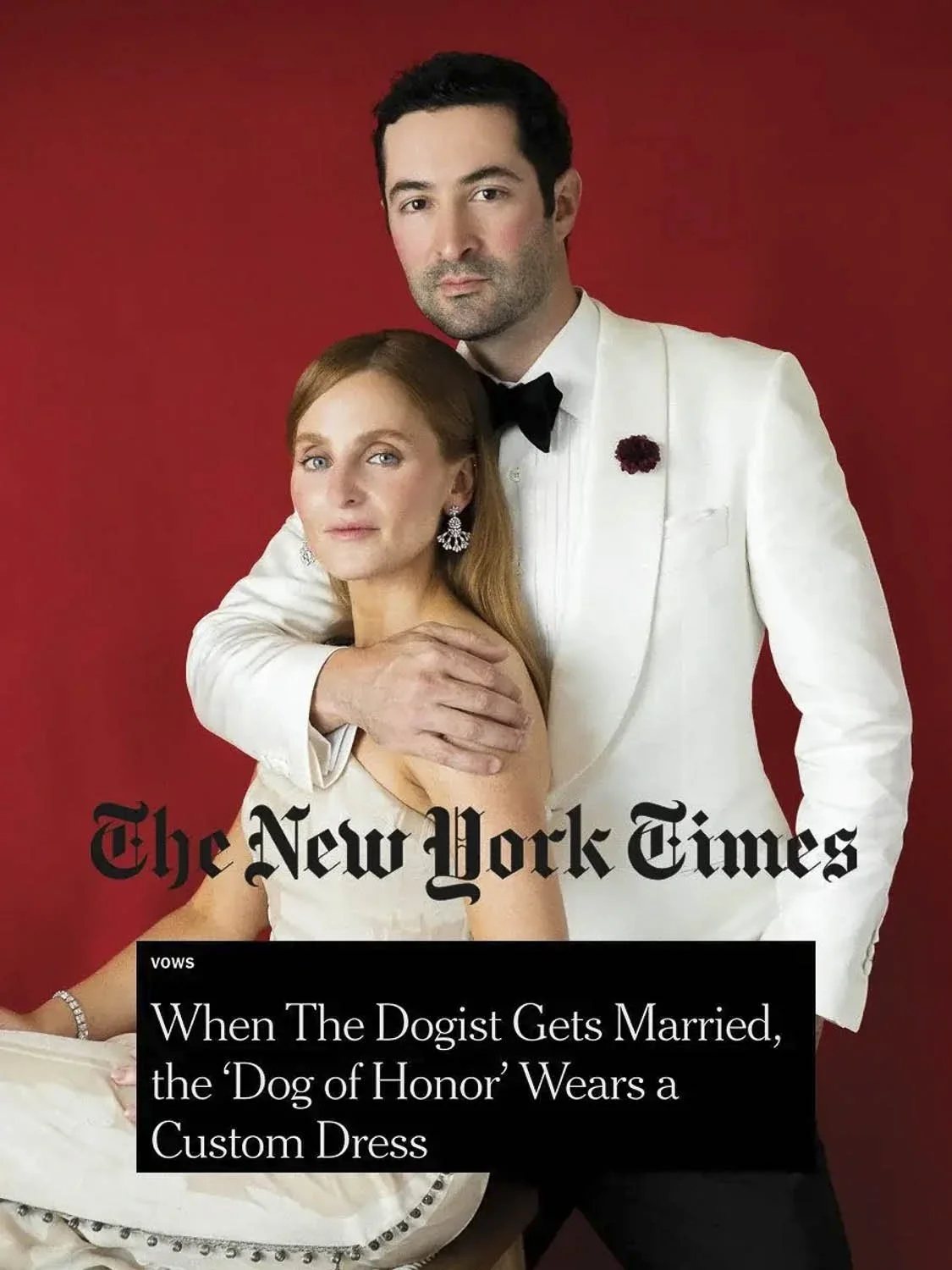 A man in a white tuxedo with a black bow tie and a woman in a white dress with jewelry, posing against a red background, on the cover of The New York Times magazine.