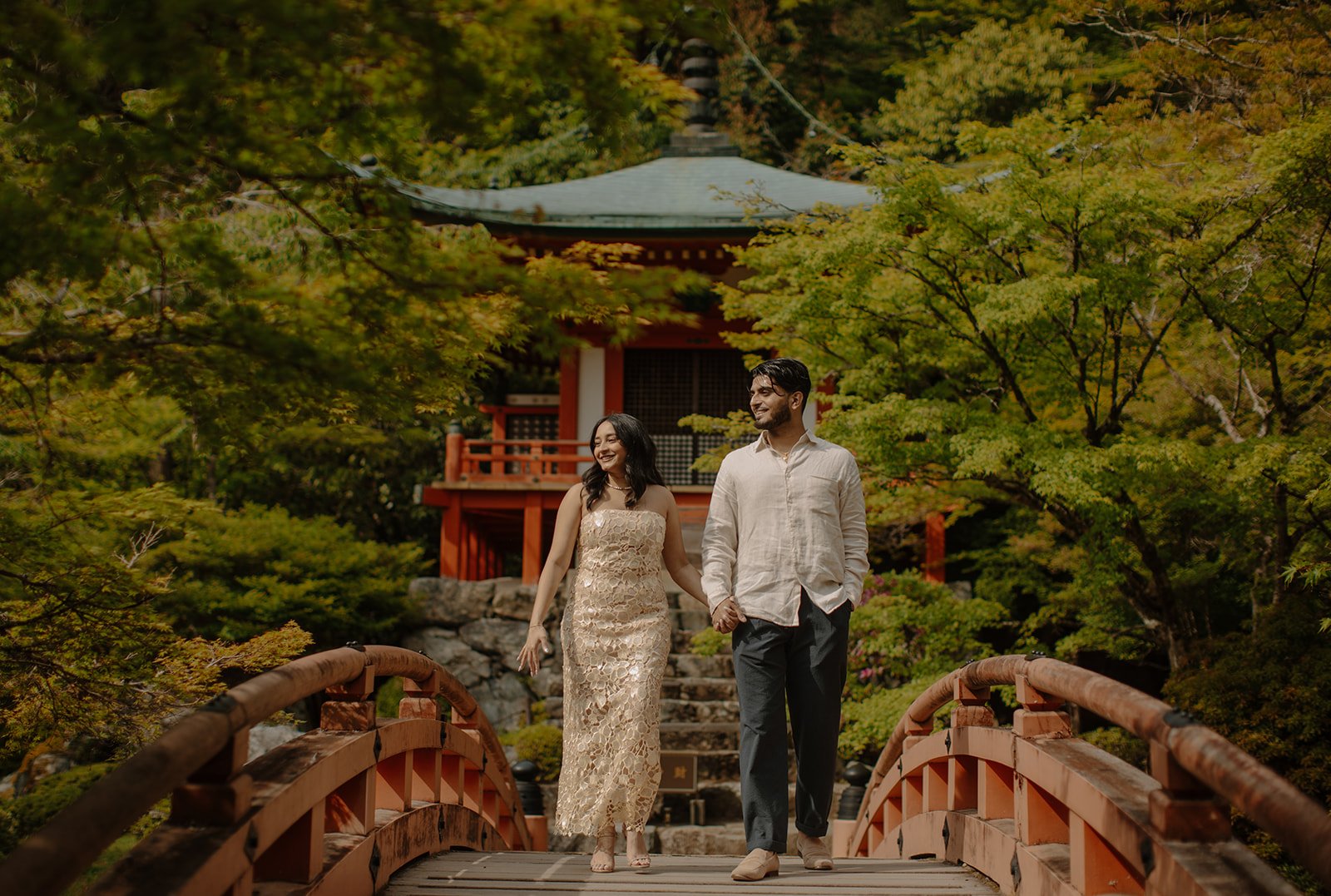 Maliha and Khizr strolling on the red bridge together, as captured in Tokyo Kyoto photo session