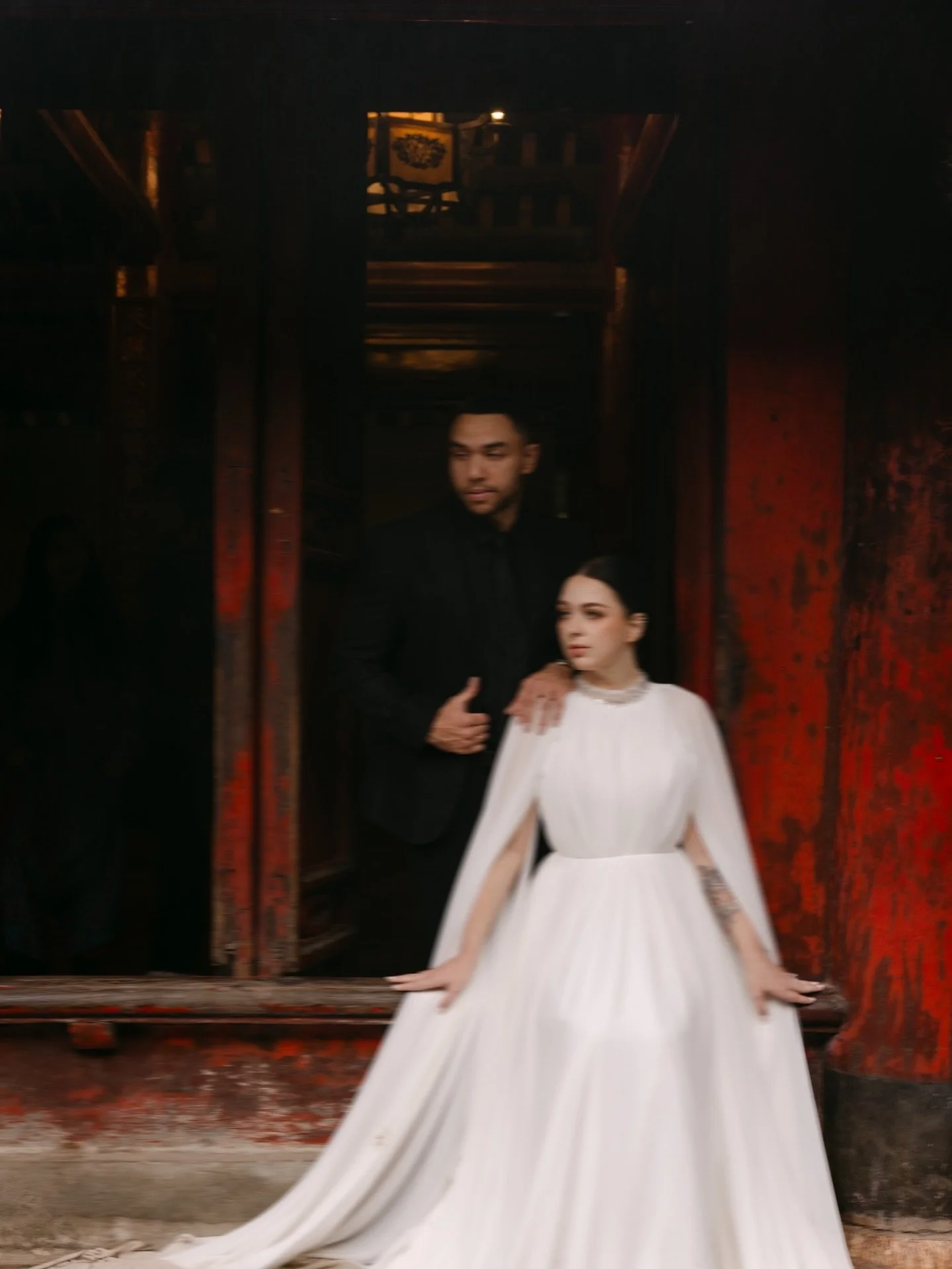 As a destination wedding photographer in Vietnam, Hanoi is one of those places that consistently delivers something layered, cinematic, and a little unexpected.

The Temple of Literature gives you contrast in the best way. Deep reds against soft ston