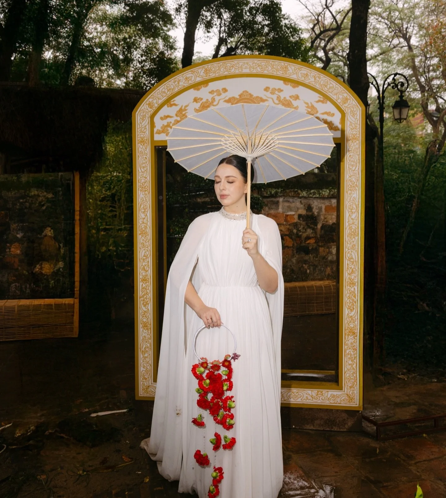 A destination wedding photographer in Vietnam quickly learns that Hanoi has a way of shaping a shoot without you needing to control much.

The Temple of Literature carries a quiet weight to it. Layers of architecture, muted textures, and pockets of l