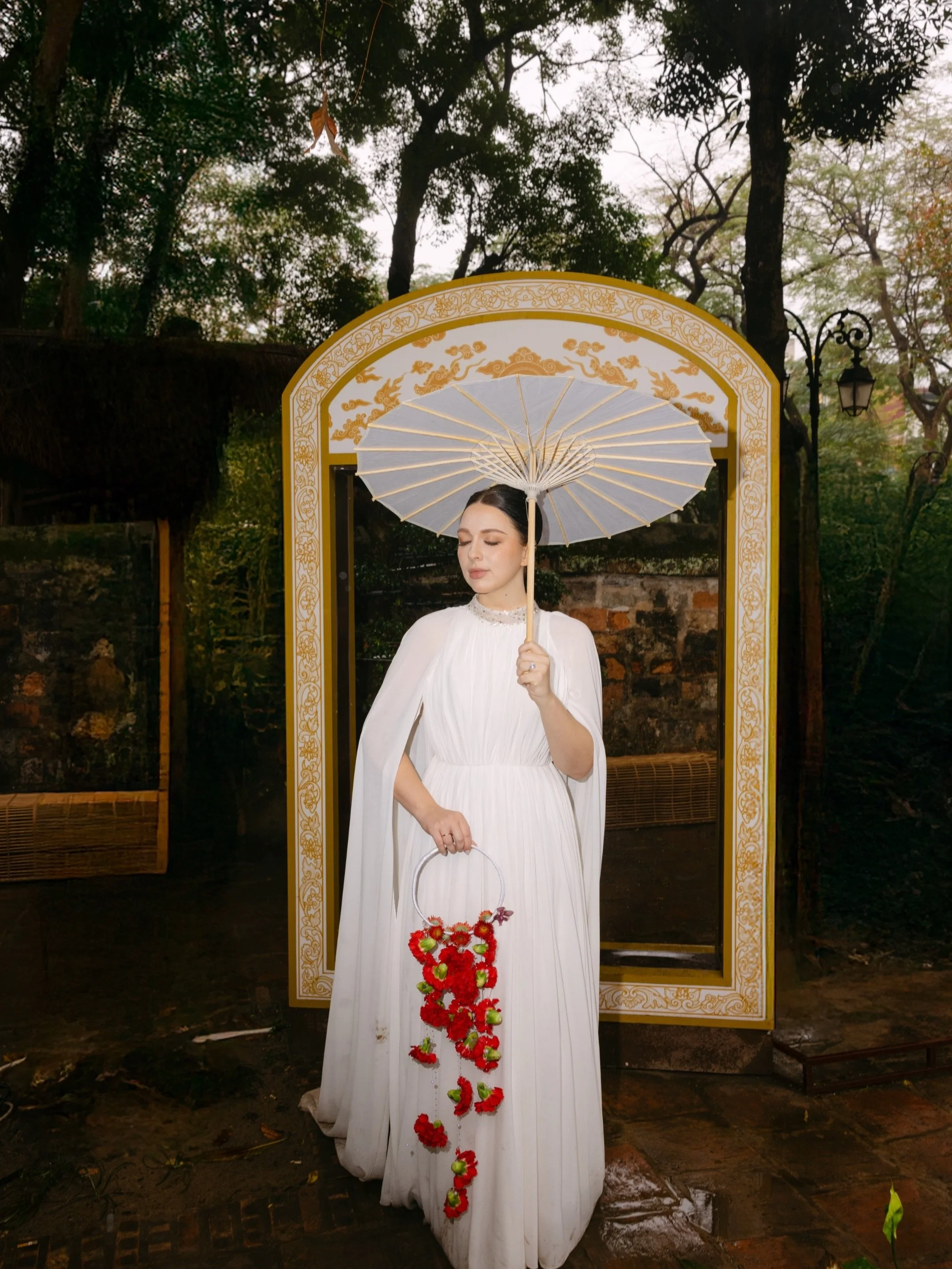 A destination wedding photographer in Vietnam quickly learns that Hanoi has a way of shaping a shoot without you needing to control much.

The Temple of Literature carries a quiet weight to it. Layers of architecture, muted textures, and pockets of l