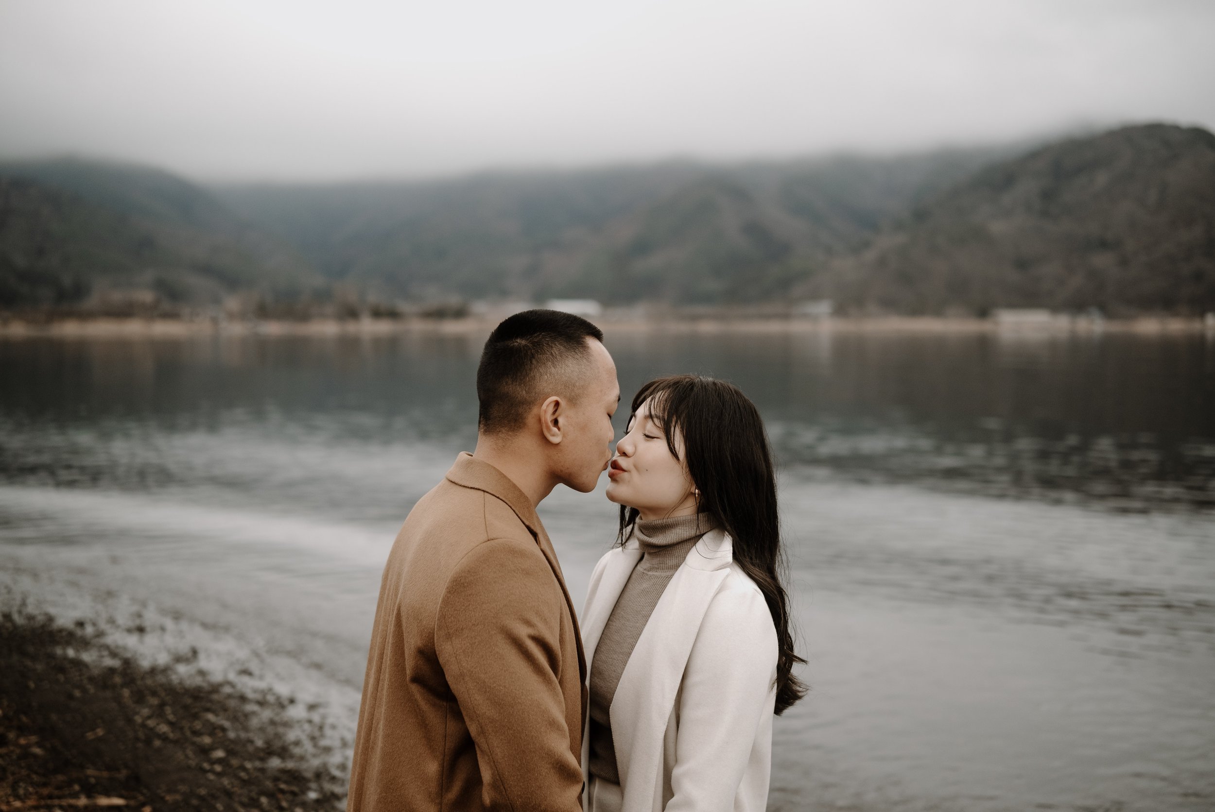 japan-overcast-engagement-kiss-lakeside-38.jpg