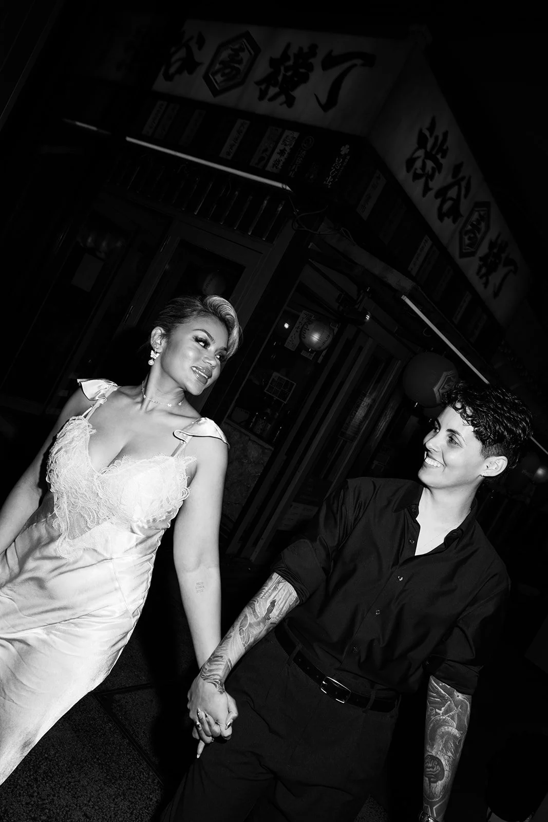 kyannie-indira-tokyo-engagement-holding-hands-bw-09.jpg