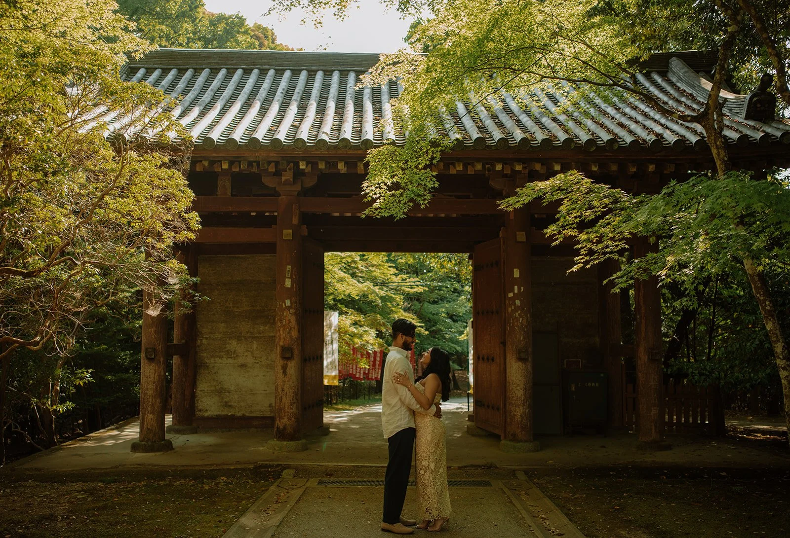 Maliha and Lhizr embracing in aesthetically framed photo of an entrance