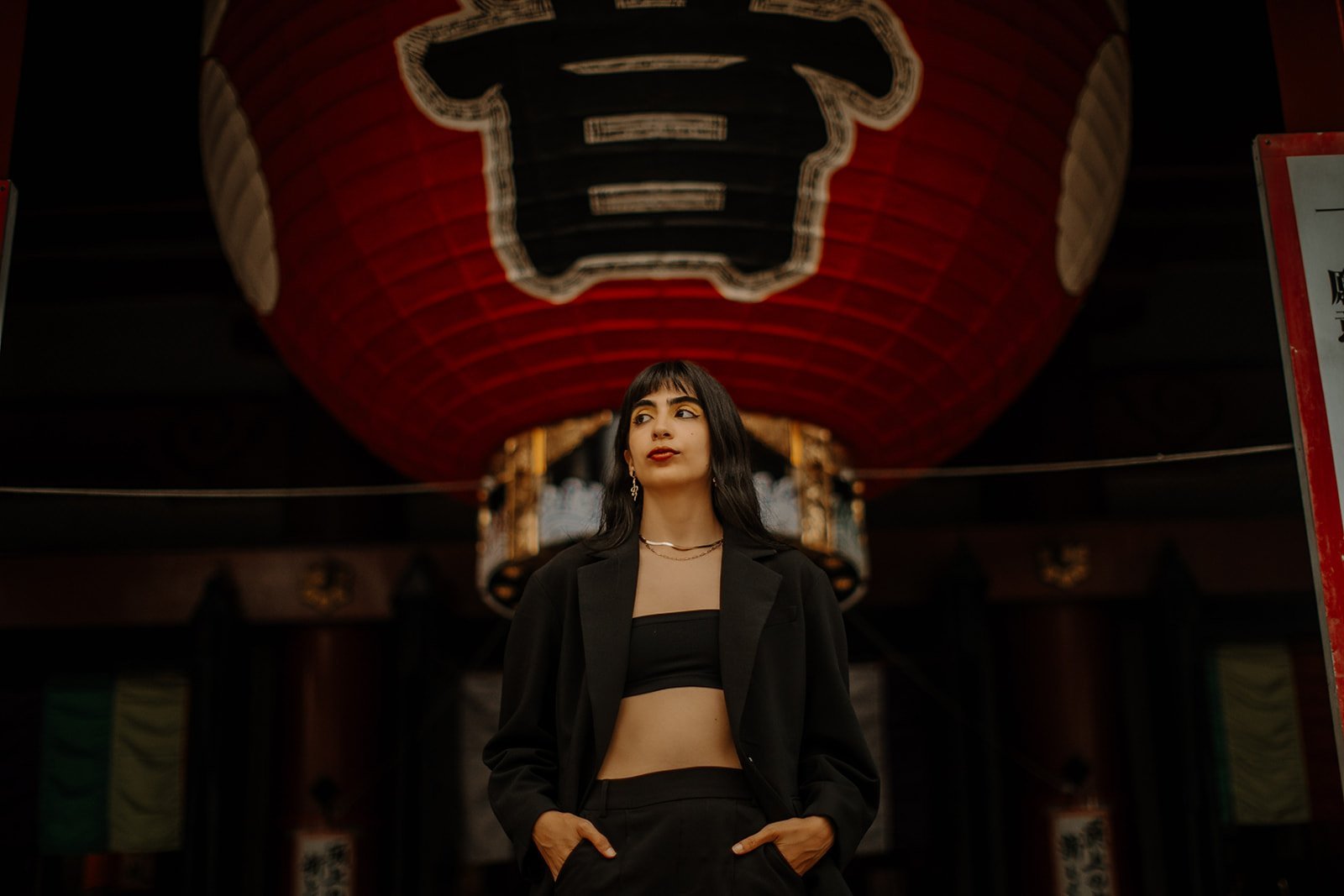 Fashion portrait beneath the giant red lantern at Kaminarimon Gate, Asakusa, Tokyo.