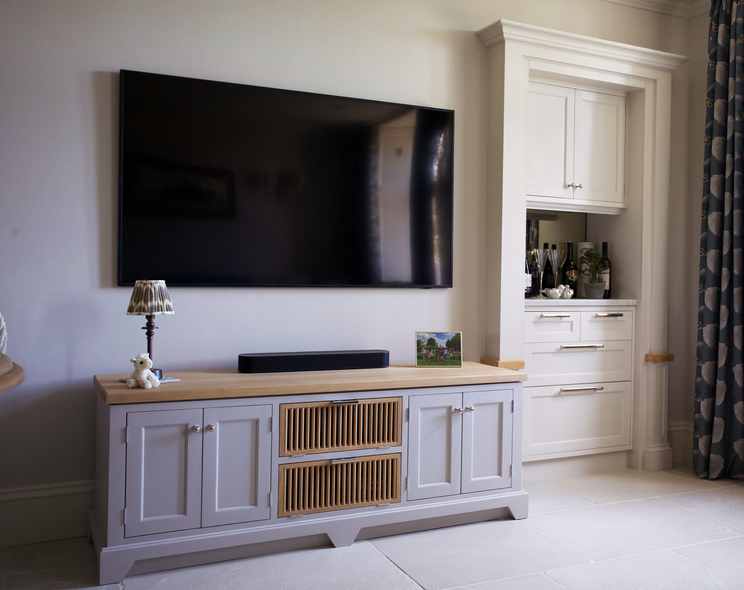 Bespoke TV and bar cabinetry for a family home's breakfast room
