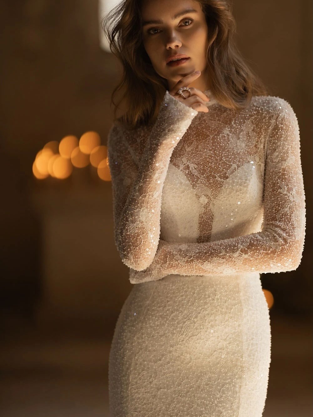 Discover the KIOTO dress, a show-stopping two-piece mermaid wedding ensemble designed to provide a customisable bridal look. This exquisite design seamlessly merges minimalist chic with intricate lace accents. The ensemble includes a simple base laye