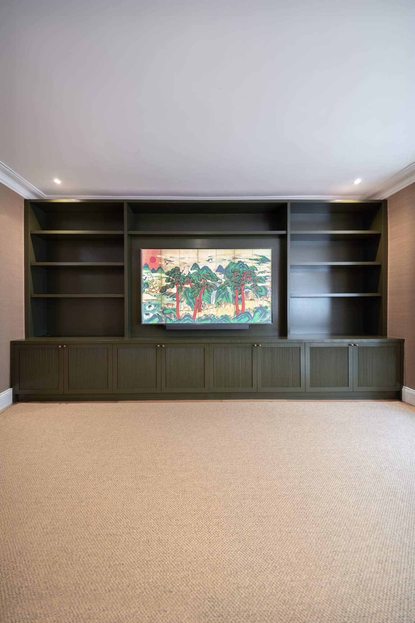 Built-in media wall side view showing depth and floor-to-ceiling joinery in West London home