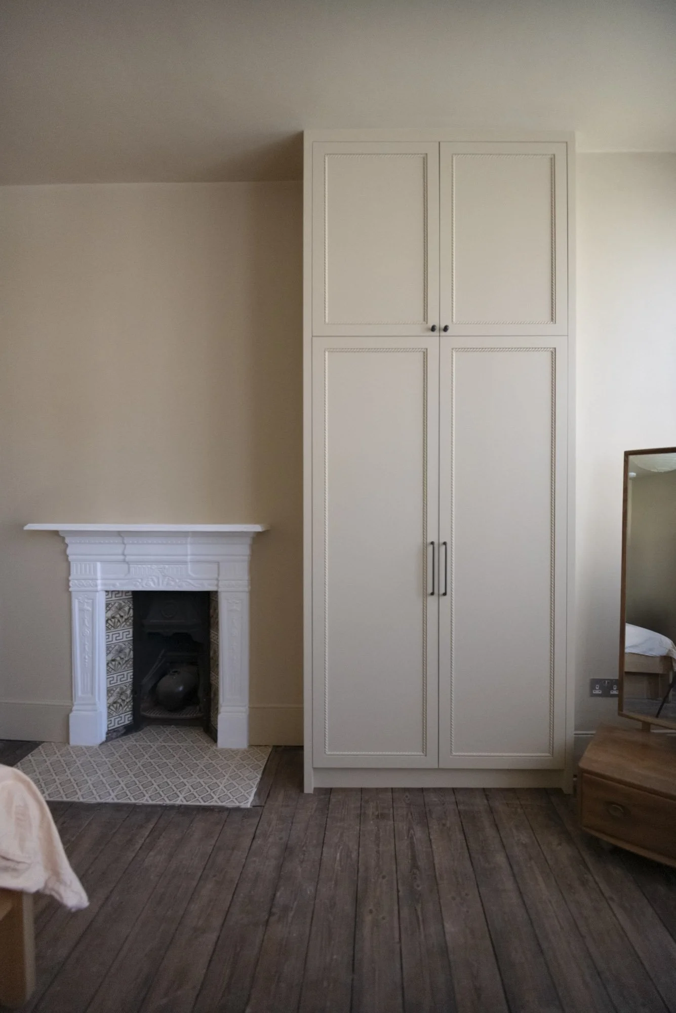 Bespoke fitted wardrobes in Camè Beige installed in North London bedroom