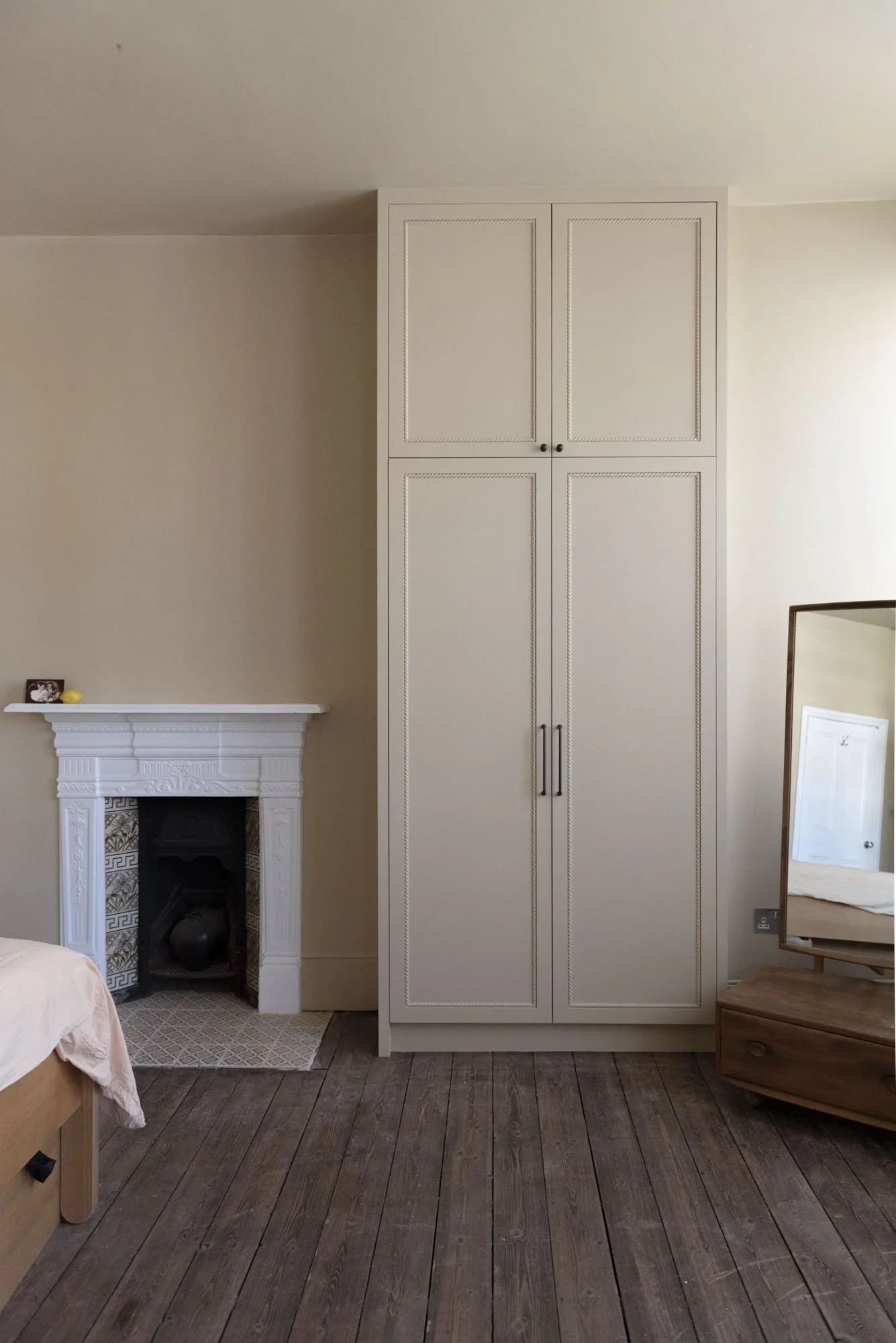 Hand-painted bespoke wardrobes finished in N19 property