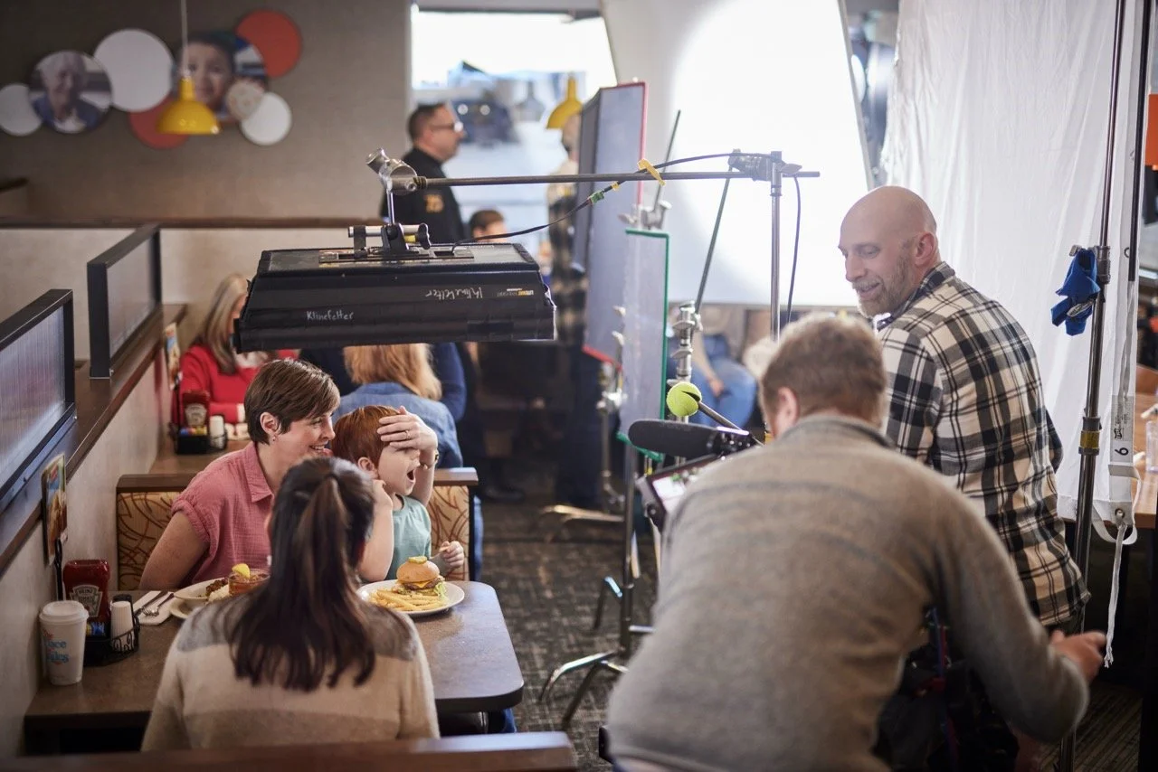 TV commercial video production filming on location at live restaurant for Pittsburgh based restaurant.  Pittsburgh commercial director working with the actors and director of photography.