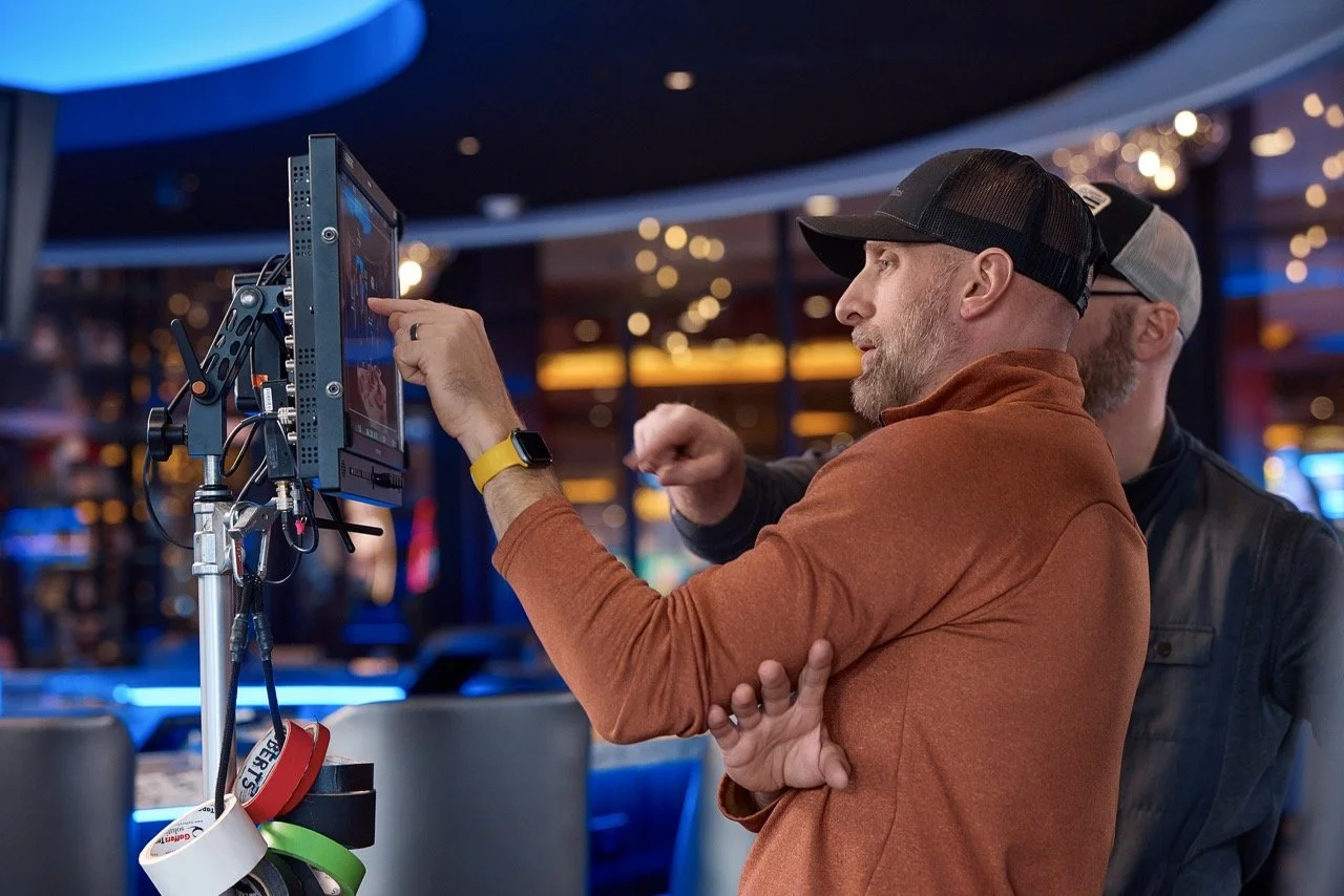 Pittsburgh commercial director and assistant director review framing on monitor for Pittsburgh casino commercial video shoot.