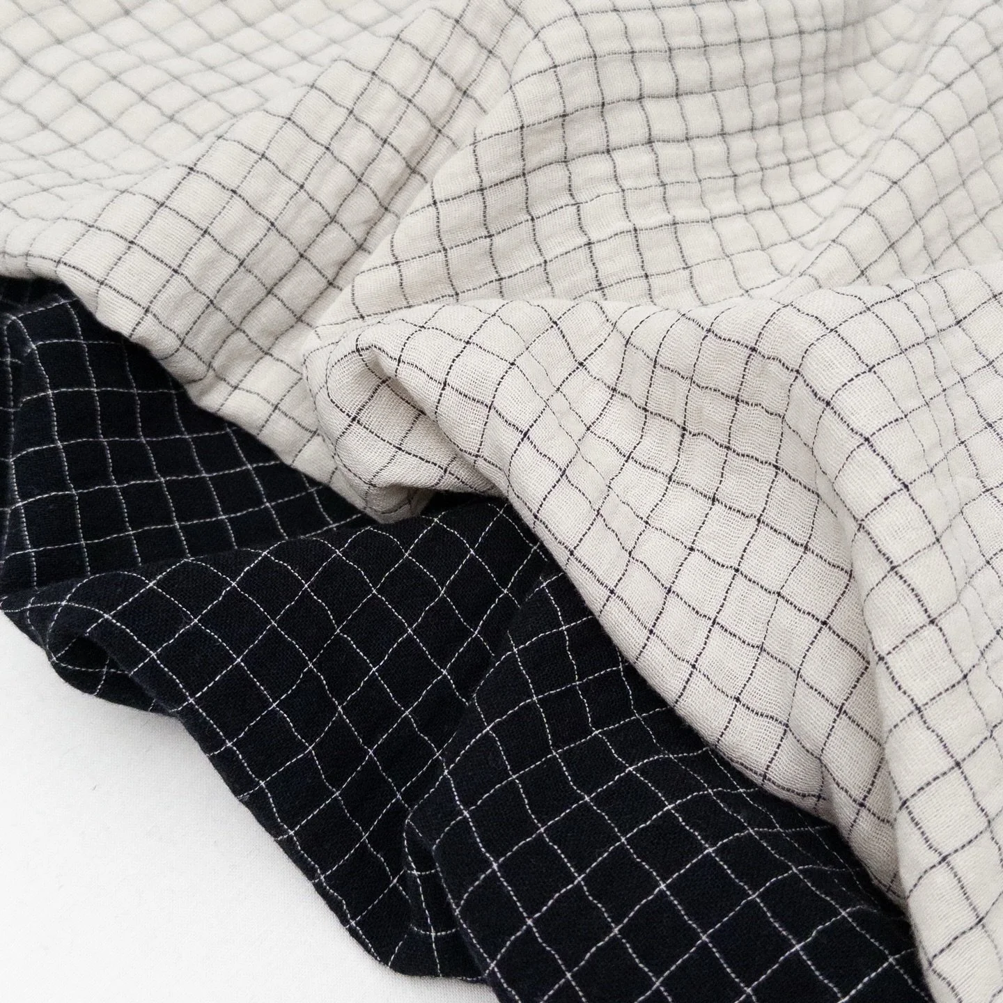 Lennon 2918: A new take on our dreamy double gauze. This windowpane check is available in Natural and Black 🖤

Lennon is a 100% organic cotton, yarn-dyed, double gauze fabric. The double gauze construction creates a soft and cozy texture, while the 