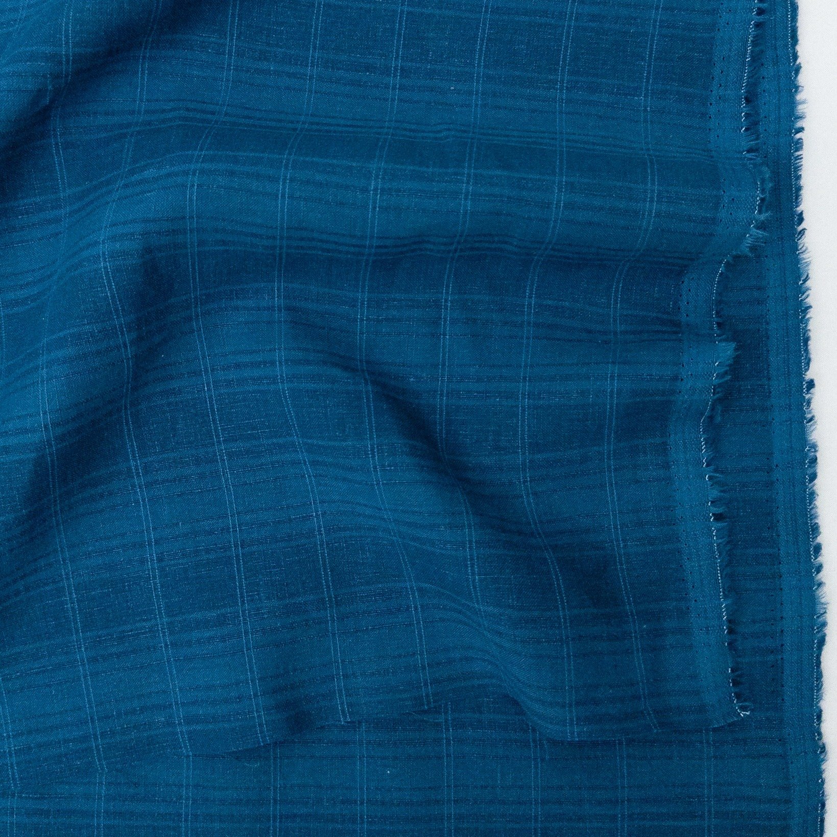 A close-up look at Rhode. ✨ This is our new linen/cotton blend, made with a woven dobby plaid design. At 167 GSM, it offers just the right amount of structure for elevated, everyday shirts, pants, dresses, and more! 

View the full colour range and f