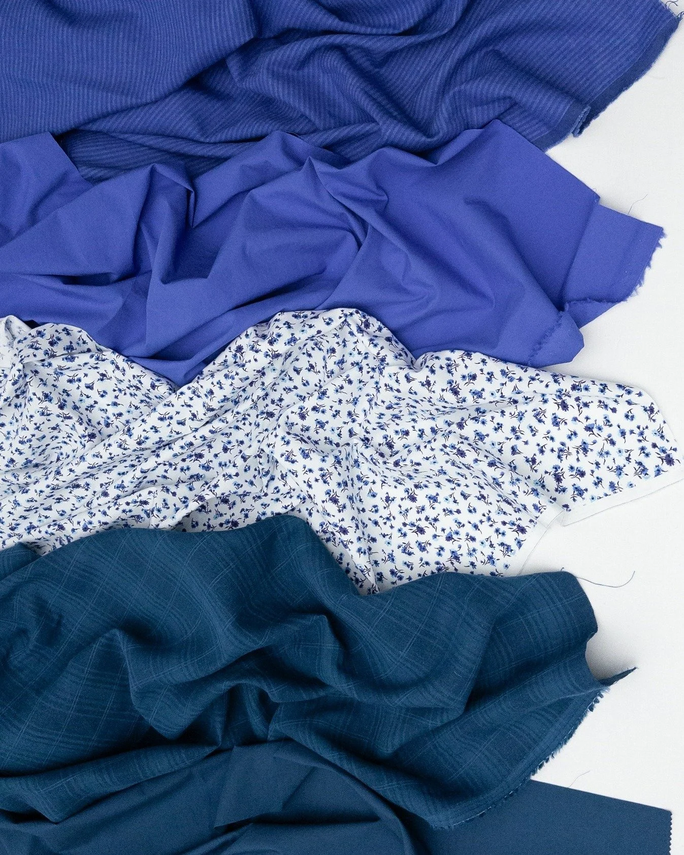 Classic jewel tones, effortlessly complemented by sapphire blue.

Pictured:
Nova cotton poplin in Ocean
Rhode linen/cotton jaquard in Jewel
Nina printed organic cotton poplin in 2938 White/Blues
Nova cotton poplin in Sapphire
Eden yarn-dyed cotton/li