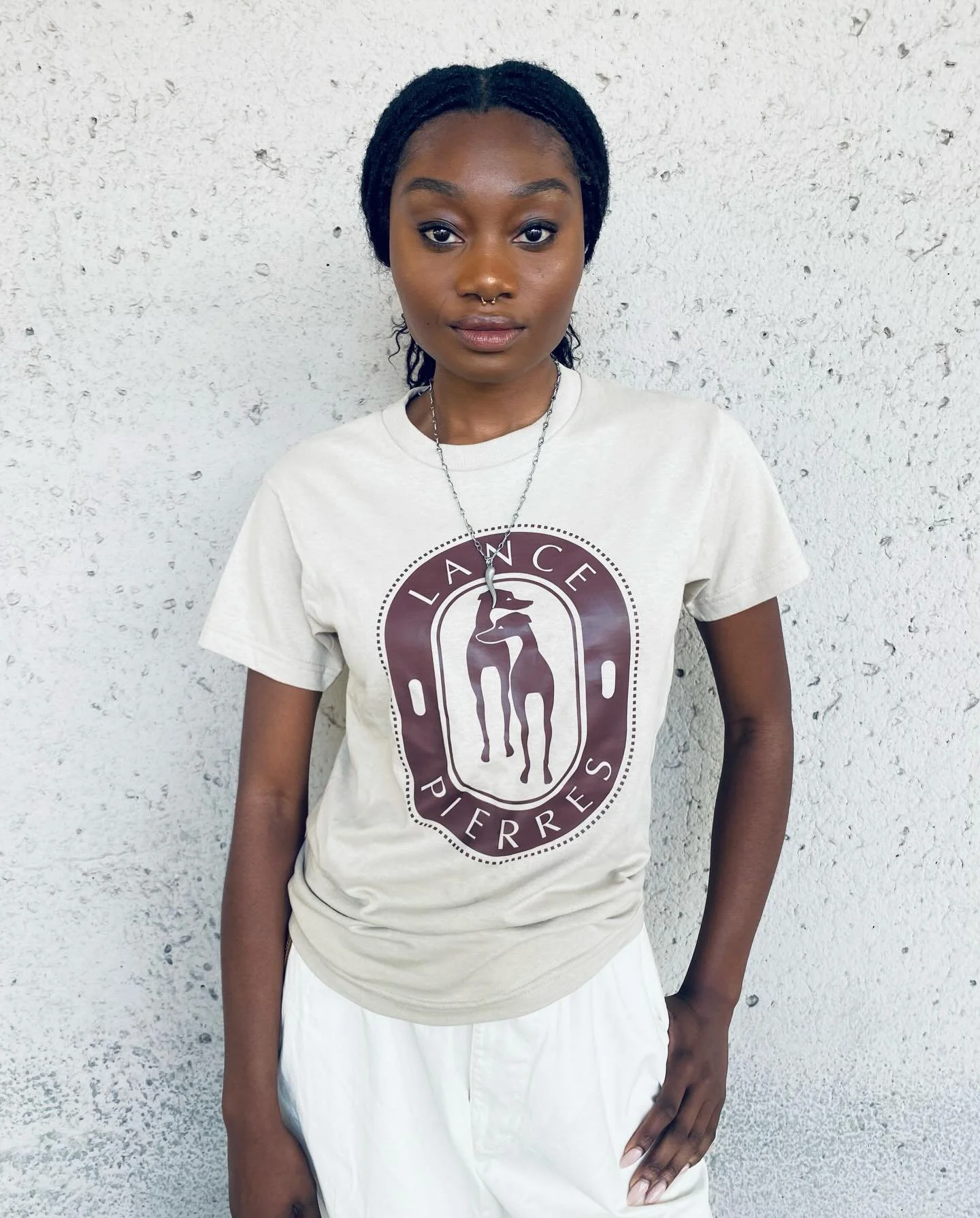 Developed during the summer of 2025, the Lance Pierres &ldquo;Twin Italian Greyhound&rdquo; emblem pays homage to Rudi and Willi, two of the brand&rsquo;s most beloved team members.

Shop full tee range plus our entire accessory assortment at www.LAN