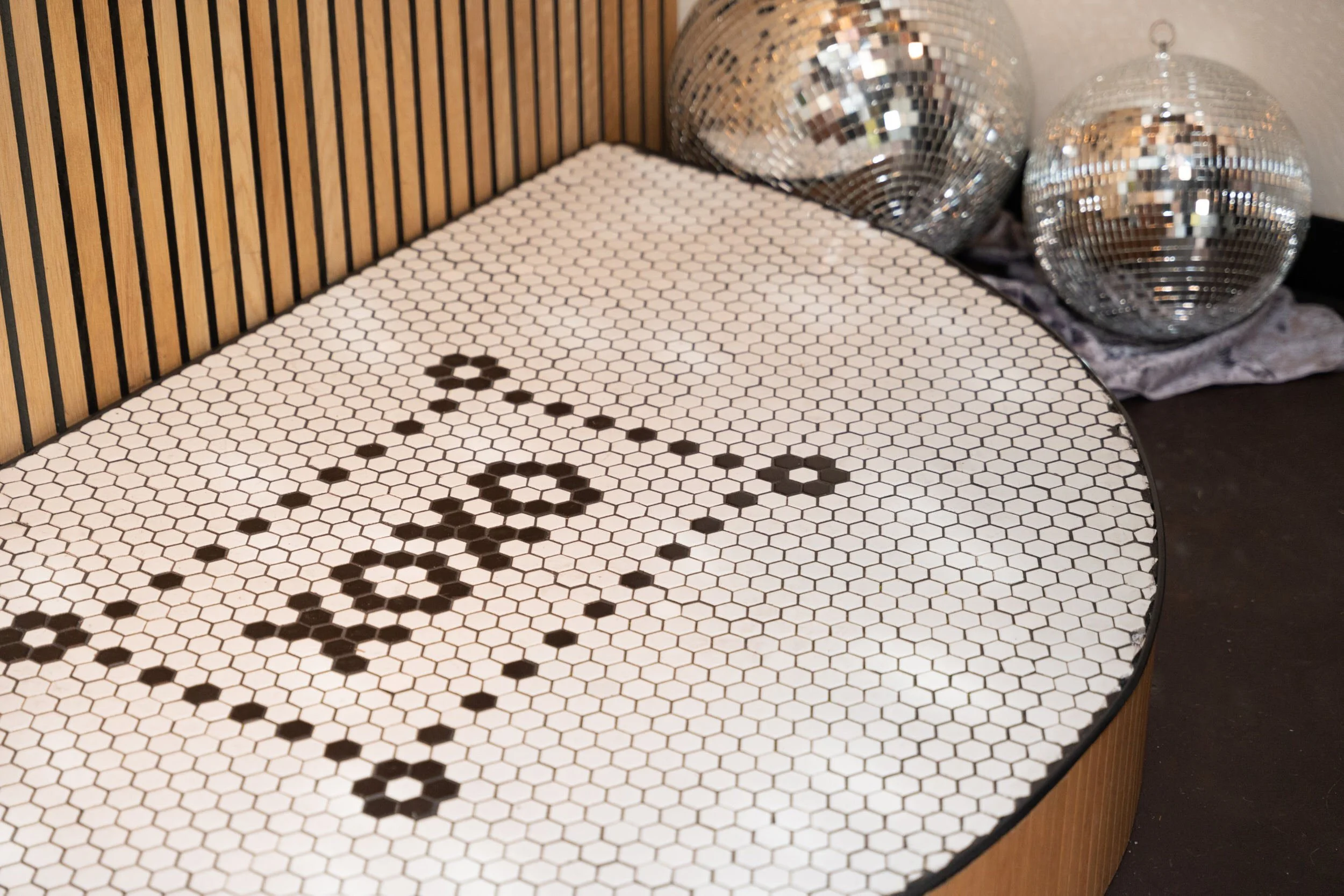  A small wedding ceremony platform with “xoxo” written in the middle 