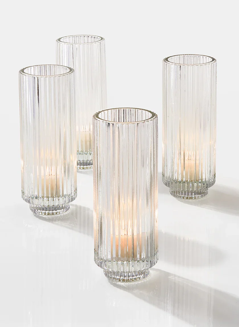 Set of 20 – Votives in ribbed glass holders ($75)