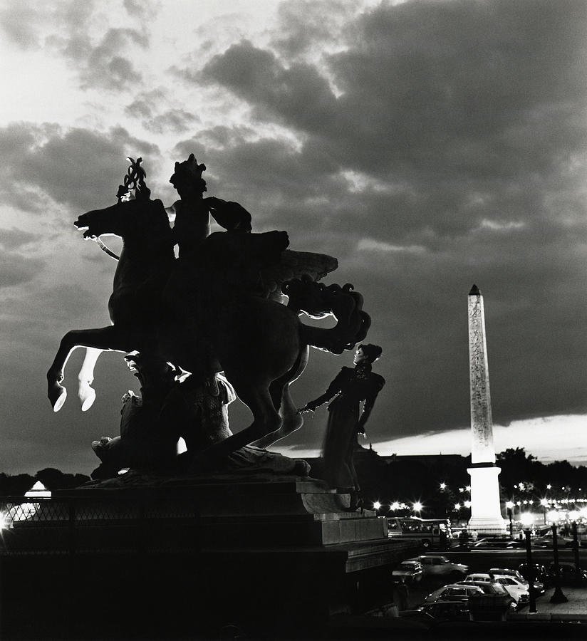 Silhouette of a model by 'Mercury Riding Pegasus' statue in the Tuileries Garden in Paris, Vogue