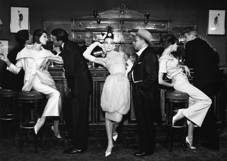 Audrey Hepburn and Art Buchwald, with Simone D’Aillencourt, Frederick Eberstadt, Barbara Mullen, and Dr. Reginald Kernan, evening dresses by Balmain, Dior, and Patou, Maxim's Paris, August 1959