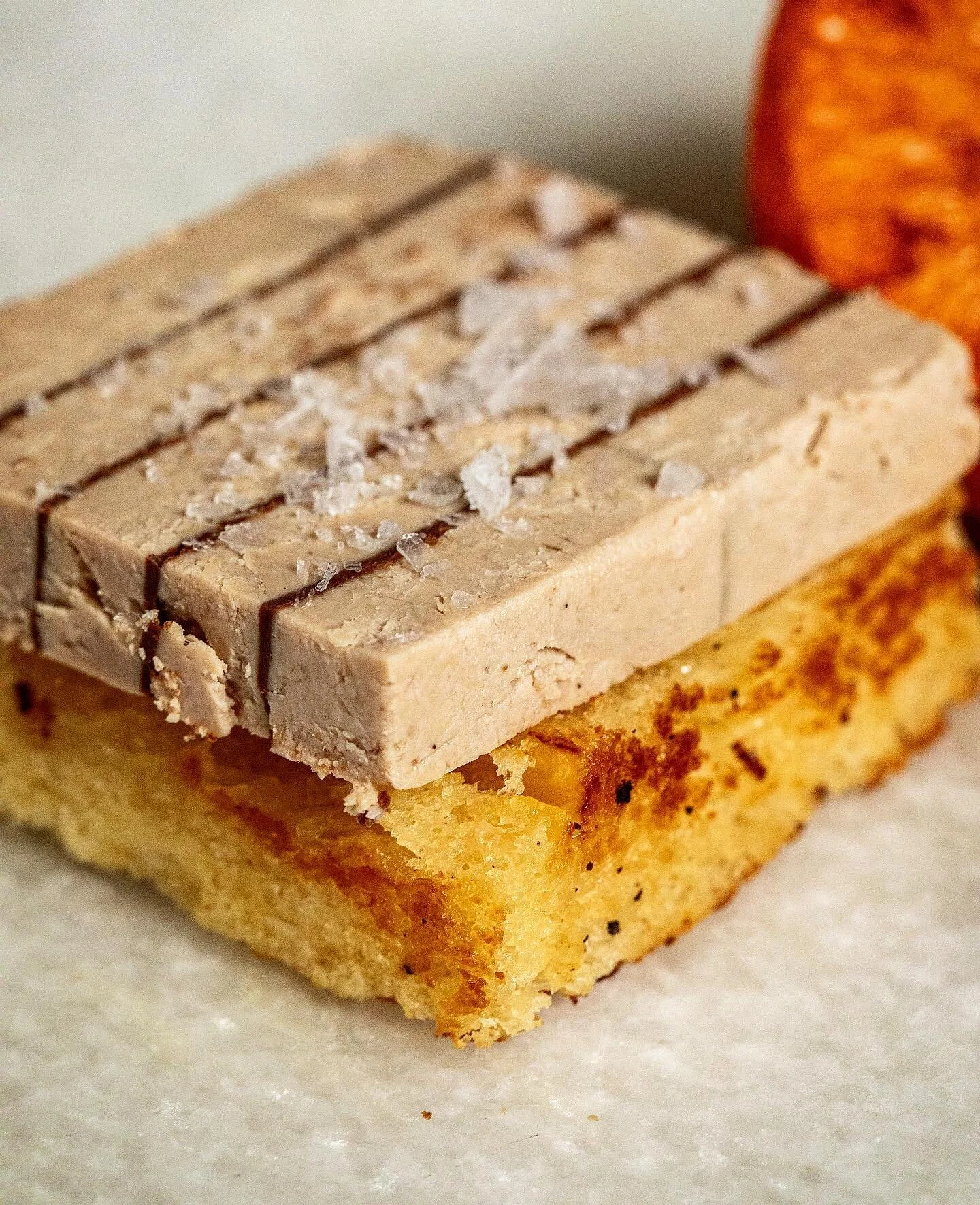 Foie gras chocolate layers with fleur de sel on homemade brioche toast and kumquat preserve🍊