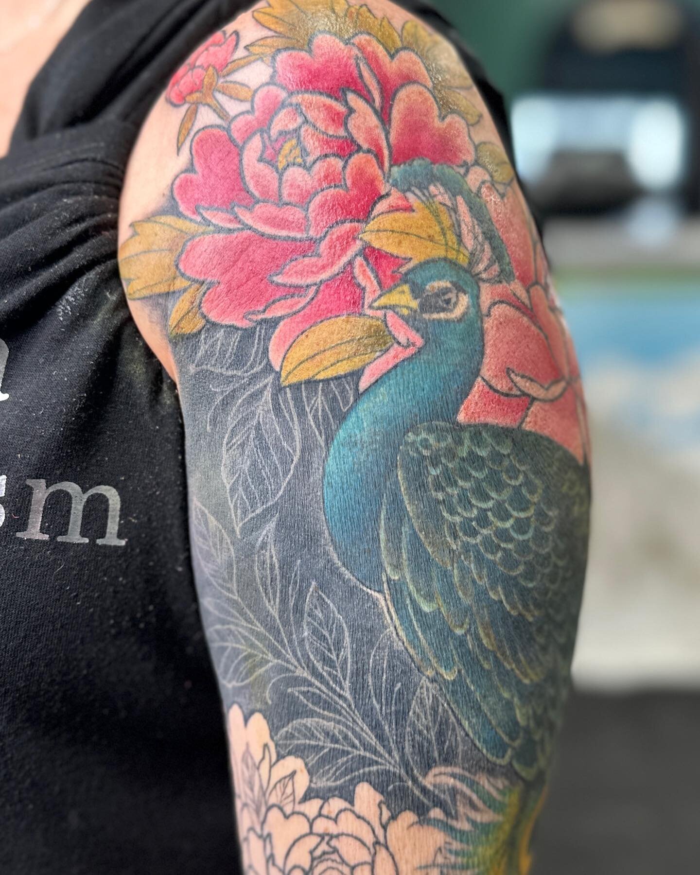 Dani is one of my favorite clients! This is the second sleeve I’m doing on her. This is a #coveruptattoo of a pretty big tribal piece. We’re going all-out in this one. Look at those colors, and the way the #whiteonblacktattoo is coming ou