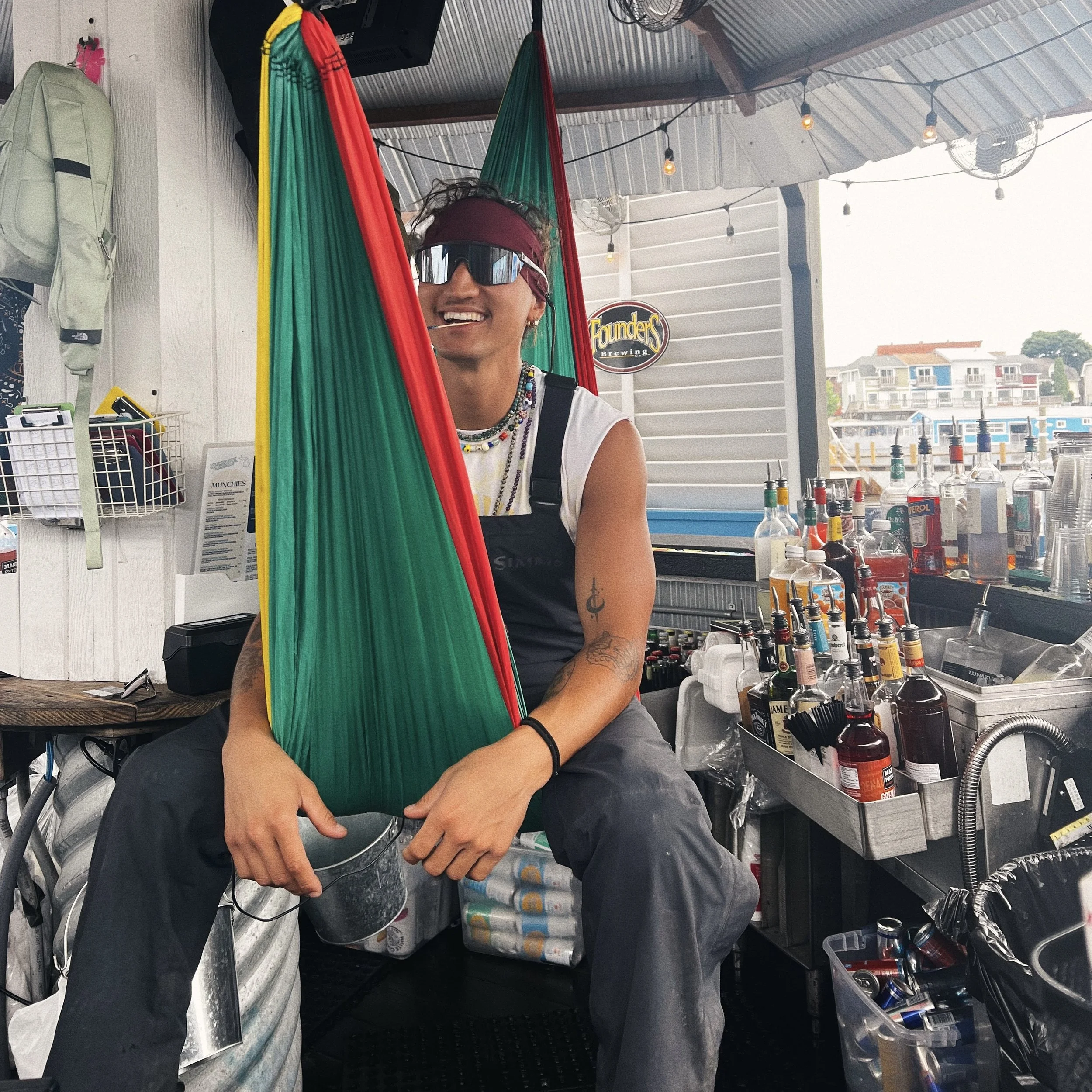 bartender sitting in a hammock