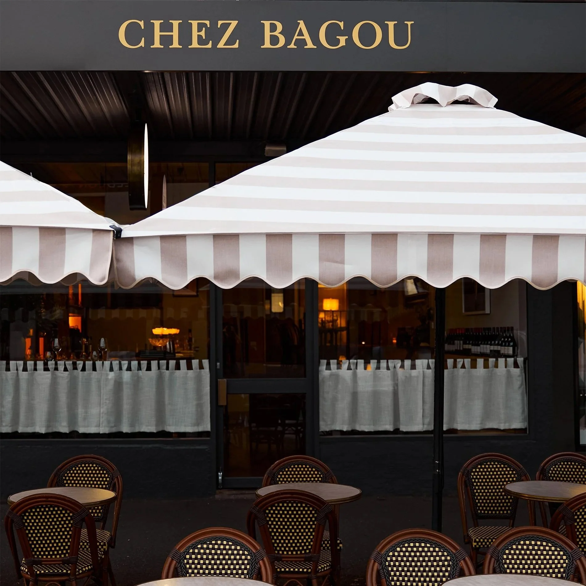 Chez Bagou restaurant exterior with striped awnings and outdoor tables, Albert Park Melbourne