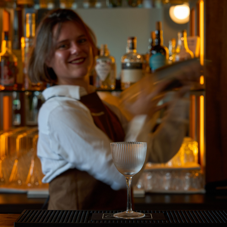 Bartender at the bar at Chez Bagou French restaurant, Albert Park Melbourne