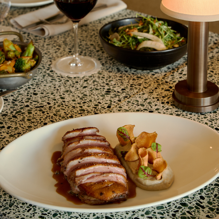 Duck confit with jus and roasted vegetables at Chez Bagou, Albert Park Melbourne