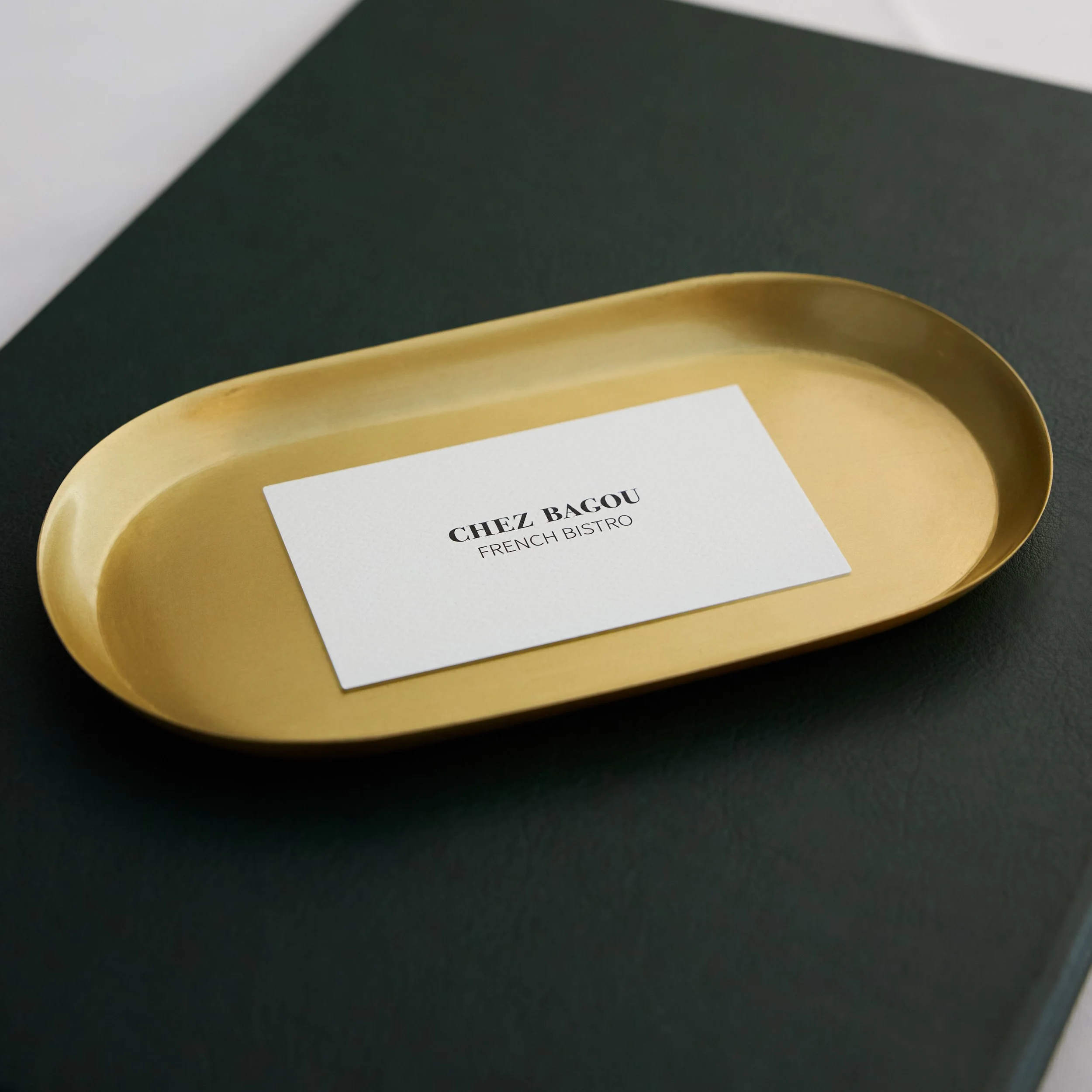 Chez Bagou French Bistro gift voucher card on a gold tray