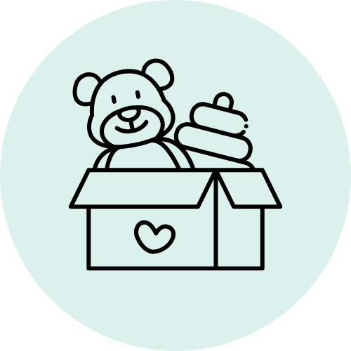 Cute teddy bear sitting in a box with a heart on it, holding a baby bottle.