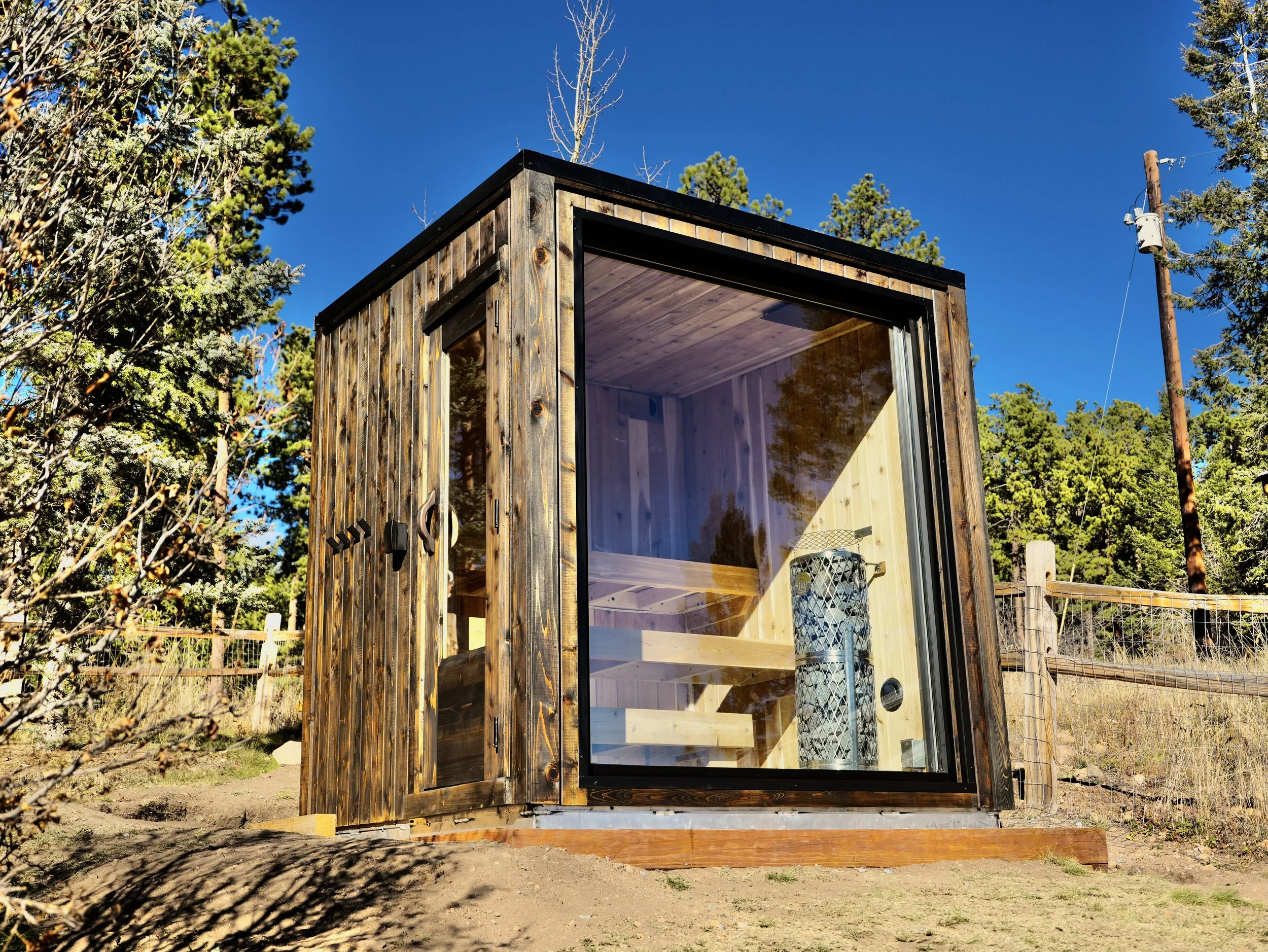 Sauna in rustic area, treated knotty cedar