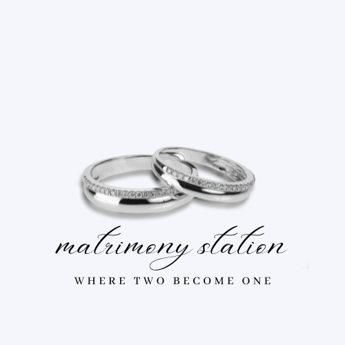 Two wedding rings with embedded diamonds, jewelry for marriage, with the text "matrimony station where two become one" in elegant script.