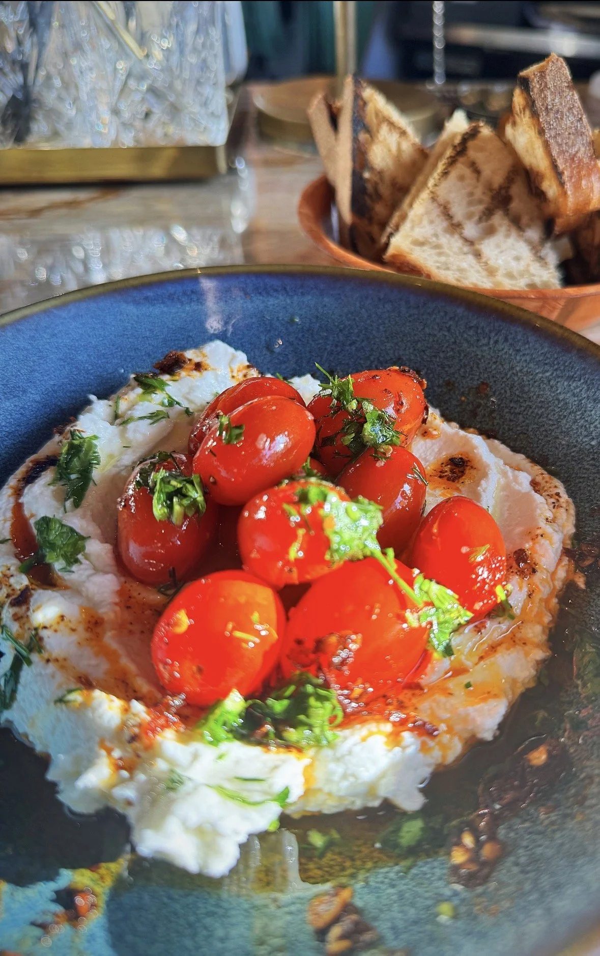 Roast Garlic Labneh with Blistered Cherry Tomatoes, Chili Oil & Herbs