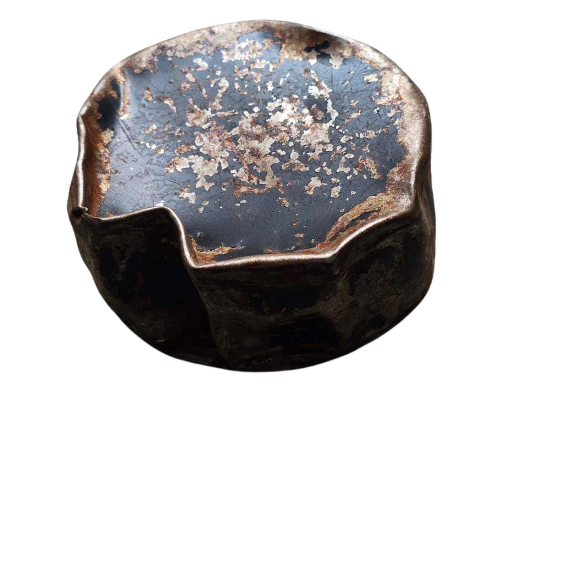 Close-up of a worn, rusty, and chipped metal object with a rounded edge.