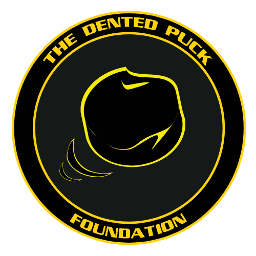 Logo of The Dented Puck Foundation featuring a dented hockey puck with a yellow outline on a black background, encircled by the foundation's name in yellow text.